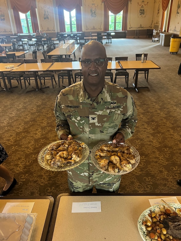 Army Colonel poses with food