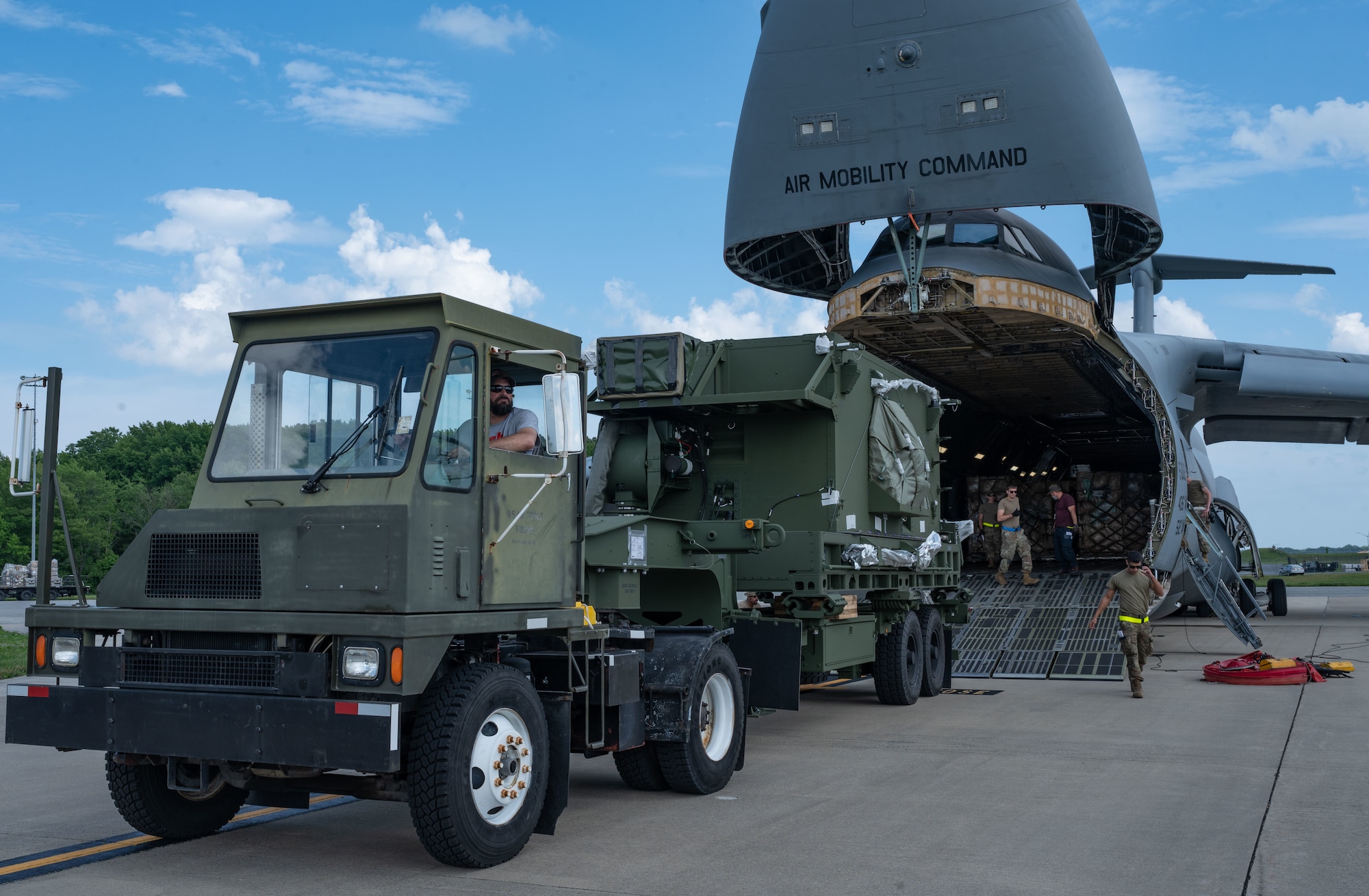 Team Dover Airmen load a communication relay group onto a C-5M Super Galaxy during a foreign military sales mission with Romania at Dover Air Force Base, Delaware, June 27, 2023. The partnership between the United States and Romania is rooted in a shared commitment to democratic values, including the rule of law, open markets, respect for and the promotion of human rights. (U.S. Air Force photo by Senior Airman Cydney Lee)