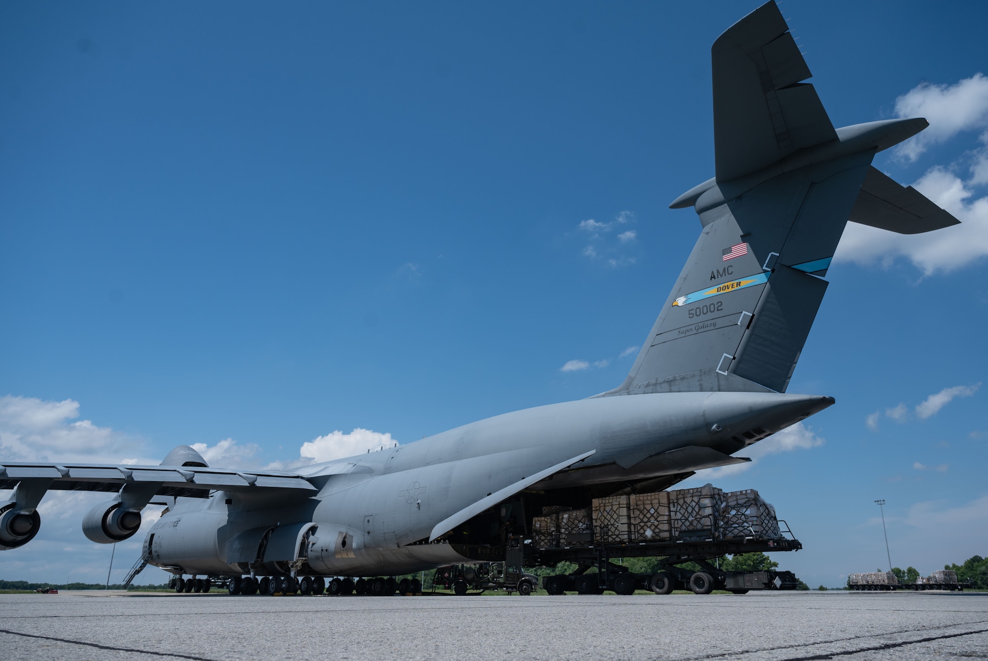 Cargo, bound for Romania, is loaded onto a C-5M Super Galaxy during a foreign military sales mission at Dover Air Force Base, Delaware, June 27, 2023. The partnership between the United States and Romania is rooted in a shared commitment to democratic values, including the rule of law, open markets, respect for and the promotion of human rights. (U.S. Air Force photo by Senior Airman Cydney Lee)