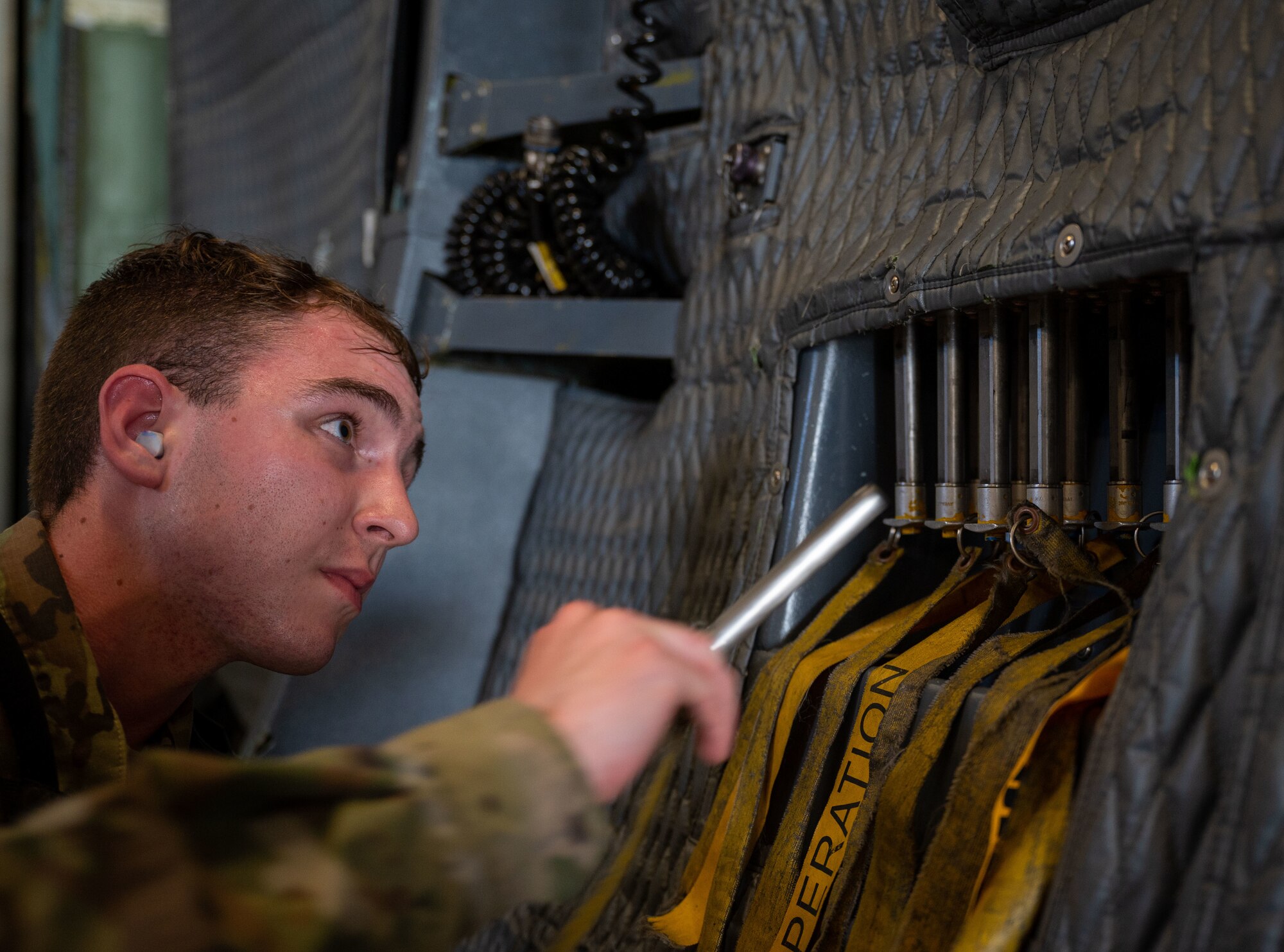 Staff Sgt. Tristan Sheese, 436th Aerial Port Squadron ramp operation supervisor, stows forward ramp lock pins on a C-5M Super Galaxy during a foreign military sales mission with Romania at Dover Air Force Base, Delaware, June 27, 2023. The partnership between the United States and Romania is rooted in a shared commitment to democratic values, including the rule of law, open markets, respect for and the promotion of human rights. (U.S. Air Force photo by Airman 1st Class Amanda Jett)