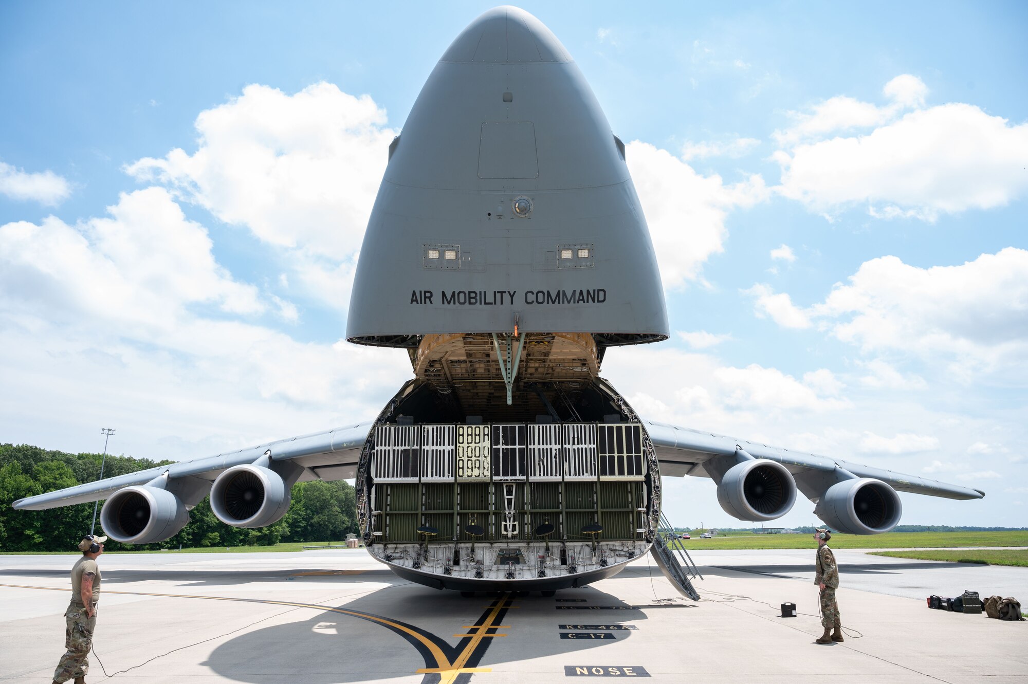 Team Dover Airmen open the visor of a C-5M Super Galaxy during a foreign military sales mission with Romania at Dover Air Force Base, Delaware, June 27, 2023. The partnership between the United States and Romania is rooted in a shared commitment to democratic values, including the rule of law, open markets, respect for and the promotion of human rights. (U.S. Air Force photo by Airman 1st Class Amanda Jett)