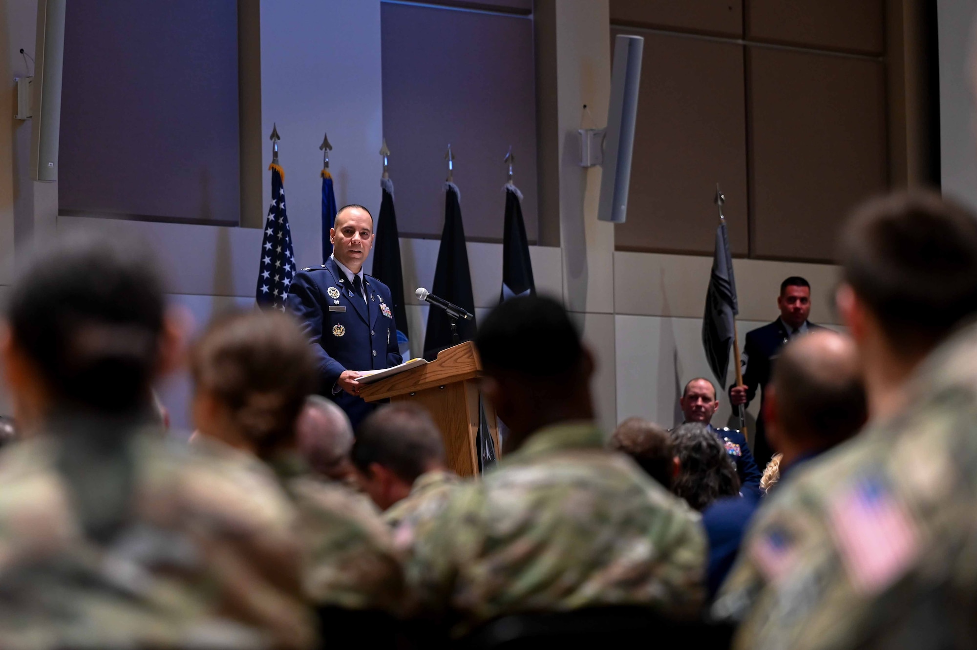 A man speaks at a podium.