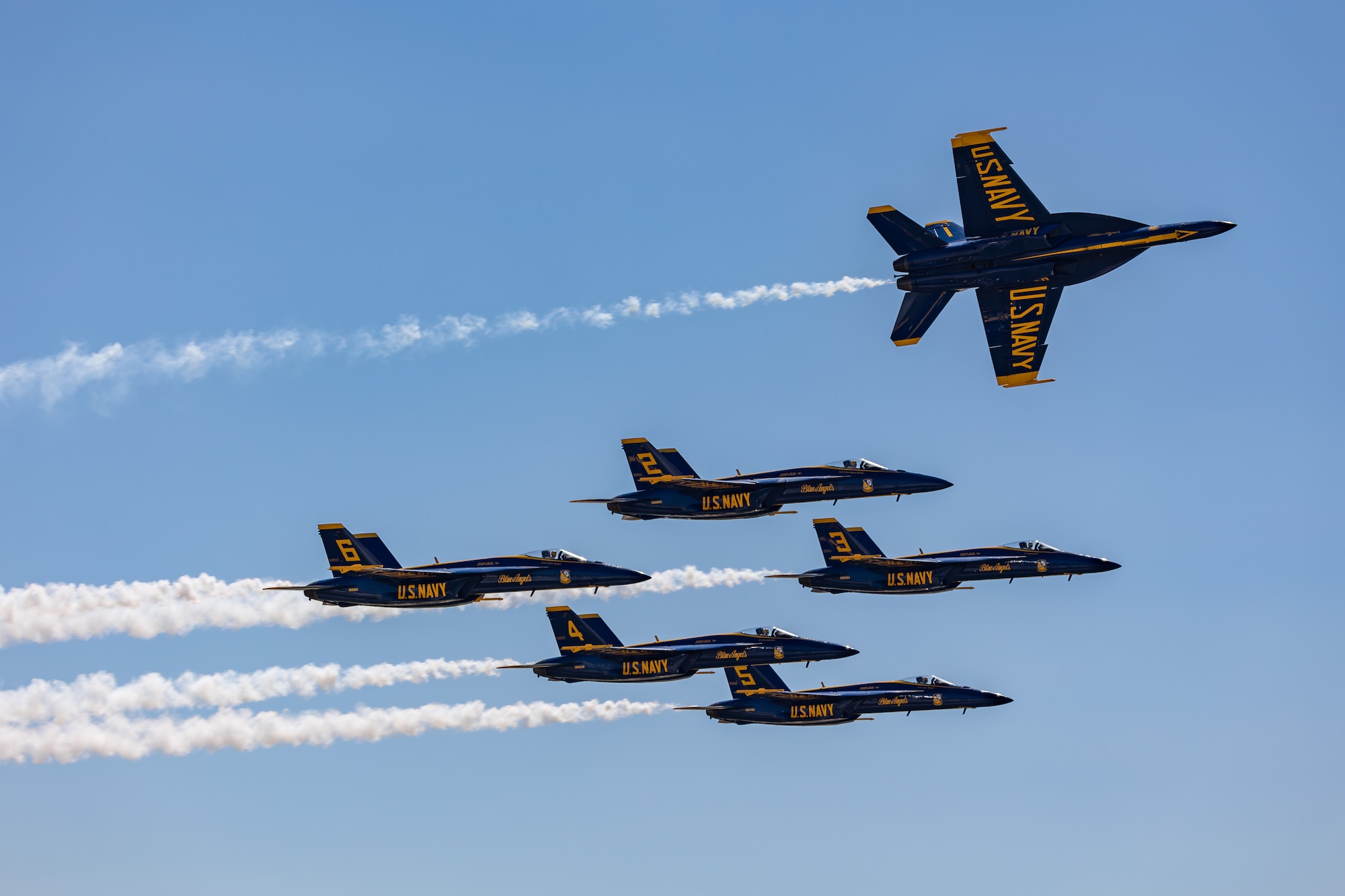 airplane pulls away from its formation