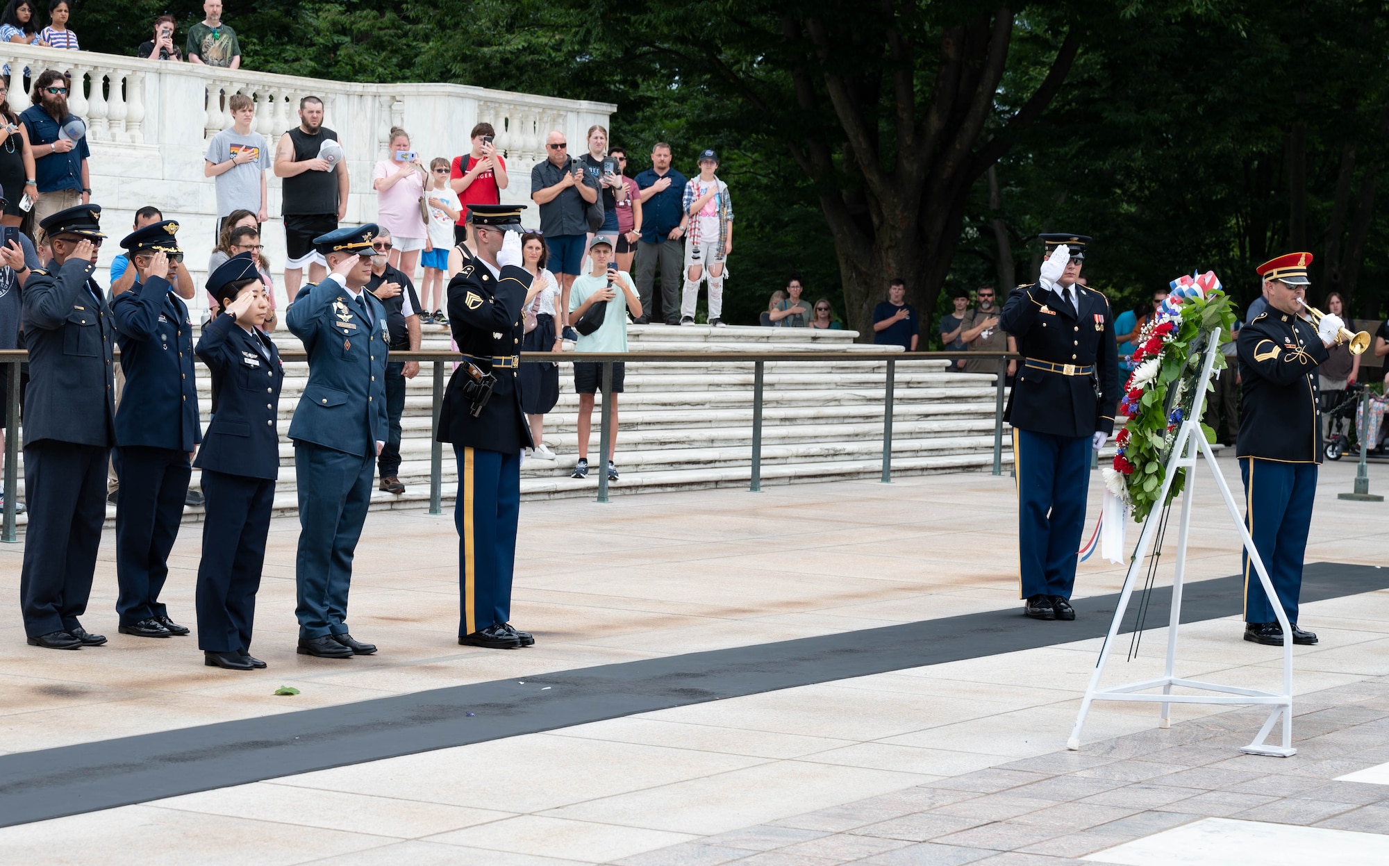 Military officers from Ukraine, Japan, Columbia and South Africa participate in the ceremonial laying of the wreath at the Tomb of the Unknown Soldier in Arlington National Cemetery July 10, 2023. International military students from the 2023-2024 Air Command and Staff College class paid formal respect to the sacrifices of America’s veterans by placing a wreath before the Tomb. The International Officer School at Air University sponsored the Washington D.C. trip July 9-13, 2023 for international students to develop a deeper understanding of the U.S federal government and U.S. military.