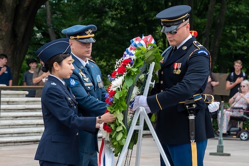 Maj. Mykhailo Ukrainets, Ukrainian Air Force and Maj. Aya Yano, Japan Air Self-Defense Force participate in the ceremonial laying of the wreath at the Tomb of the Unknown Soldier in Arlington National Cemetery July 10, 2023. International military students from the 2023-2024 Air Command and Staff College class paid formal respect to the sacrifices of America’s veterans by placing a wreath before the Tomb. The International Officer School at Air University sponsored the Washington D.C. trip July 9-13, 2023 for international students to develop a deeper understanding of the U.S federal government and U.S. military.