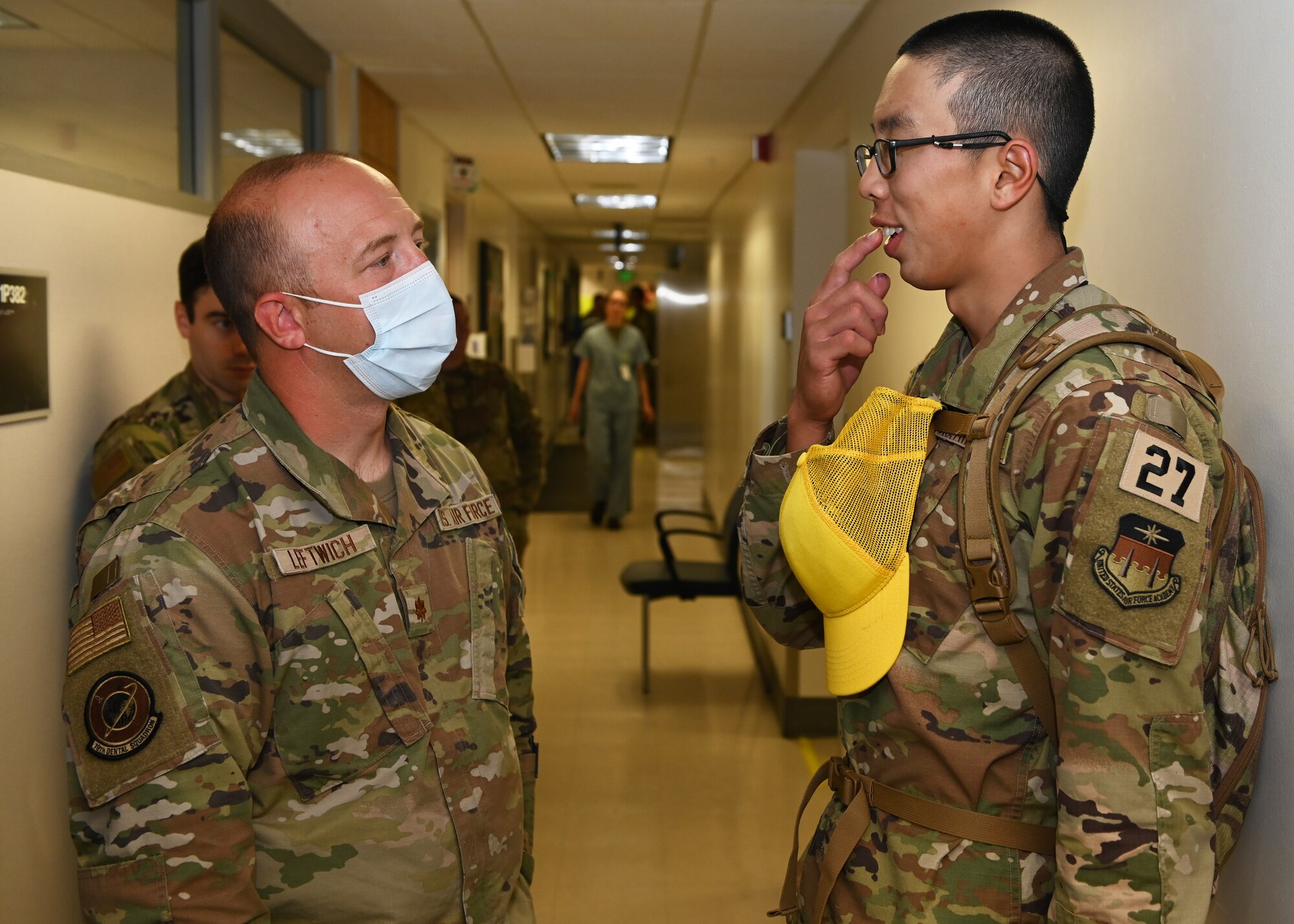 Maj. Greyson Leftwich, 10th Medical Group dentist, evaluates a basic cadet during dental in-processing at the U.S. Air Force Academy’s Cadet Dental Clinic, July, 10, 2023. A team of 75 officers and enlisted Airmen processed more than 1,000 basic cadets during a span of seven duty days.