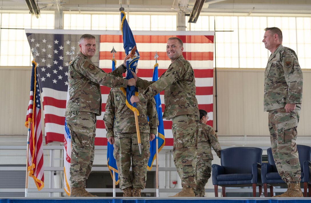 JOINT BASE LANGLEY-EUSTIS, Va. – U.S. Air Force Col. Matthew Altman, incoming 633d Air Base Wing commander, center, takes command from Maj. Gen. Michael G. Koscheski, 15th Air Force commander, during the 633d ABW change of command ceremony at Joint Base Langley-Eustis, Virginia, July 21, 2023. Hailing from Laughlin Air Force Base, Texas, Altman brings with him over 21 years of command, civil engineering and staff experience, as he steps into his new position to lead the wing. (U.S. Air Force photo by Tech. Sgt. Matthew Coleman-Foster)