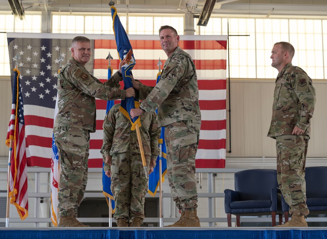JOINT BASE LANGLEY-EUSTIS, Va. –U.S. Air Force Col. Matthew Altman, incoming 633d Air Base Wing commander, center, prepares to take command from Maj. Gen. Michael G. Koscheski, 15th Air Force commander, during the 633d ABW change of command ceremony at Joint Base Langley-Eustis, Virginia, July 21, 2023. The CoC ceremony is a historic tradition dating back to the time of the Roman Legions which was then established as an American tradition in 1775 by Gen. George Washington and to this day indicates the authority of the incoming commander. (U.S. Air Force photo by Tech. Sgt. Matthew Coleman-Foster)