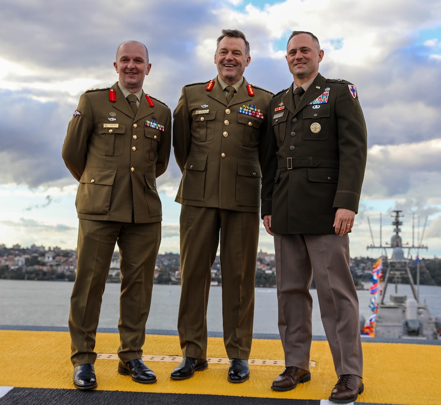 Australian Army Brig. Damian Hill, Lt. General Greg Bolton, and U.S. Army Maj. Gen. Jered Helwig pose for a photo during the opening ceremony of Talisman Sabre 2023 aboard the HMAS Canberra in Sydney Australia, July, 21, 2023. Talisman Sabre is a large-scale, bilateral military exercise between Australia and the United States, which strengthens relationships and interoperability among key allies and enhances collective capabilities to respond to a wide array of potential security concerns. This exercise will be the tenth iteration of the exercise. (US Army National Guard photo by Sgt. First Class Alexa Brumfield)