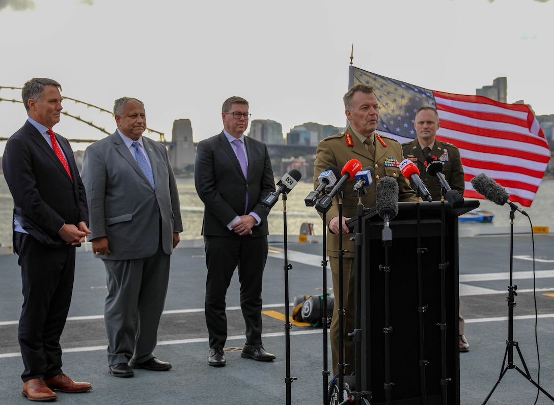 Australian Army Lt. Gen. Greg Bilton, Chief of Joint Operations, gives remarks during the opening ceremony of Talisman Sabre 2023 aboard the HMAS Canberra in Sydney Australia, July, 21, 2023. Talisman Sabre is a large-scale, bilateral military exercise between Australia and the United States, which strengthens relationships and interoperability among key allies and enhances collective capabilities to respond to a wide array of potential security concerns. This exercise will be the tenth iteration of the exercise. (US Army National Guard photo by Sgt. First Class Alexa Brumfield)