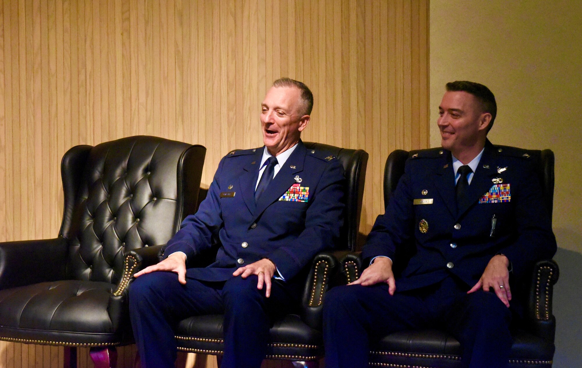 Col. Terry Koester (left) shares a laugh with Col. Grant Fowler, 982nd Training Group commander, during a change of command ceremony at Sheppard Air Force Base, Texas, July 20, 2023. Koester relinquished command of the 982d TRG. U.S. Air Force photo by Bailee Russell