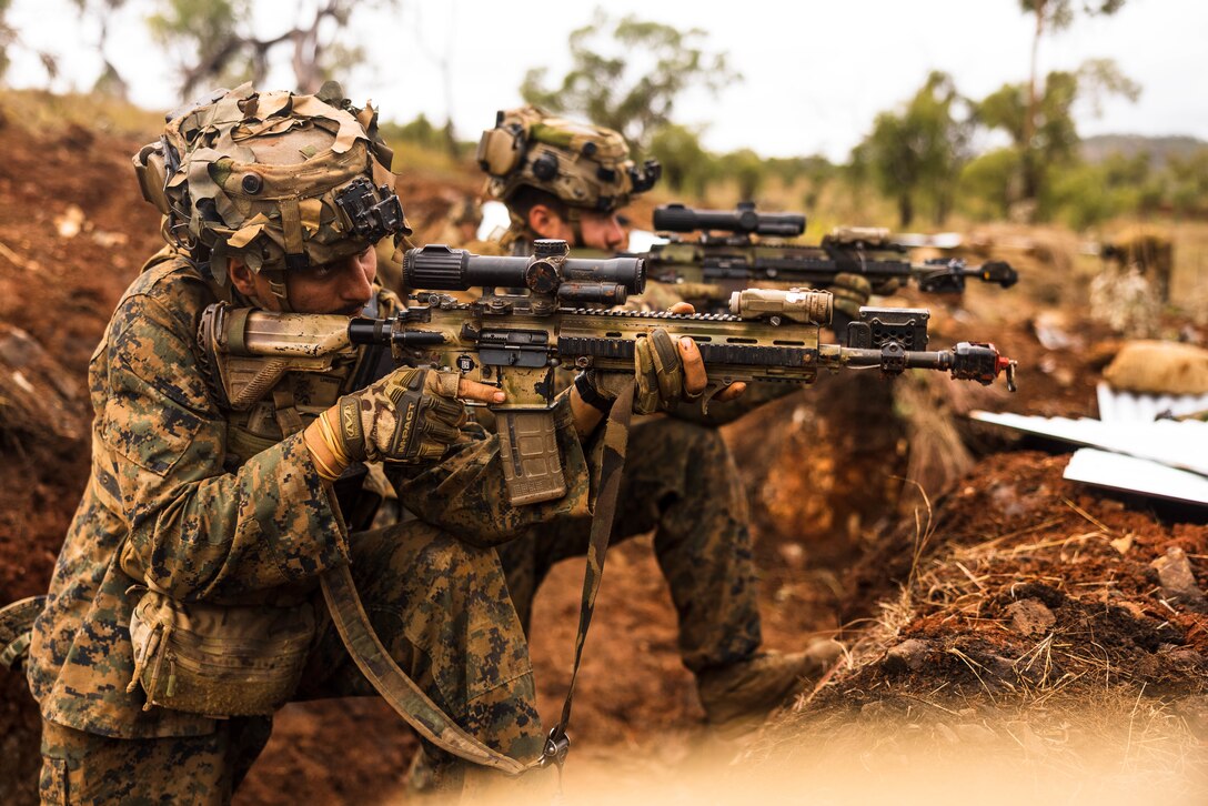 U.S. Marines with Lima Co., 3rd Battalion, 1st Marine Regiment, Marine Rotational Force – Darwin 23 engage simulated targets during Exercise Southern Jackaroo 23 in Townsville Field Training Area, Queensland, Australia, July 1, 2023. Southern Jackaroo is a trilateral exercise with MRF-D, Japanese Ground Self-Defense Force, and Australian Defence Force, with Republic of Korea observers, working together to achieve fire, maneuver, and communications interoperability objectives.