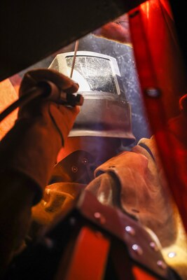 A Joint Task Force-Red Hill (JTF-RH) contractor welds a support beam during repairs in Halawa, Hawaii, April 25, 2023. JTF-RH is in phase three of its five-phase defueling plan. Personnel are focused on completing repairs, quality control tasks, training, response preparation, the National Environmental Policy Act Environmental Assessment, regulatory approvals and operational planning for all major milestones. This extensive preparatory work will help ensure the safe and expeditious defueling of the Red Hill Bulk Fuel Storage Facility. (DoD photo by U.S. Army Sgt. Kyler L. Chatman)