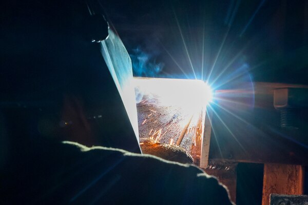 A Joint Task Force-Red Hill (JTF-RH) contractor uses a stick weld on a support beam during repairs at the Red Hill Bulk Fuel Storage Facility (RHBFSF) in Halawa, Hawaii, April 25, 2023. JTF-RH is in phase three of its five-phase defueling plan. Personnel are focused on completing repairs, quality control tasks, training, response preparation, the National Environmental Policy Act Environmental Assessment, regulatory approvals and operational planning for all major milestones. This extensive preparatory work will help ensure the safe and expeditious defueling of the RHBFSF. (DoD photo by U.S. Navy Mass Communication Specialist 2nd Class James Finney)