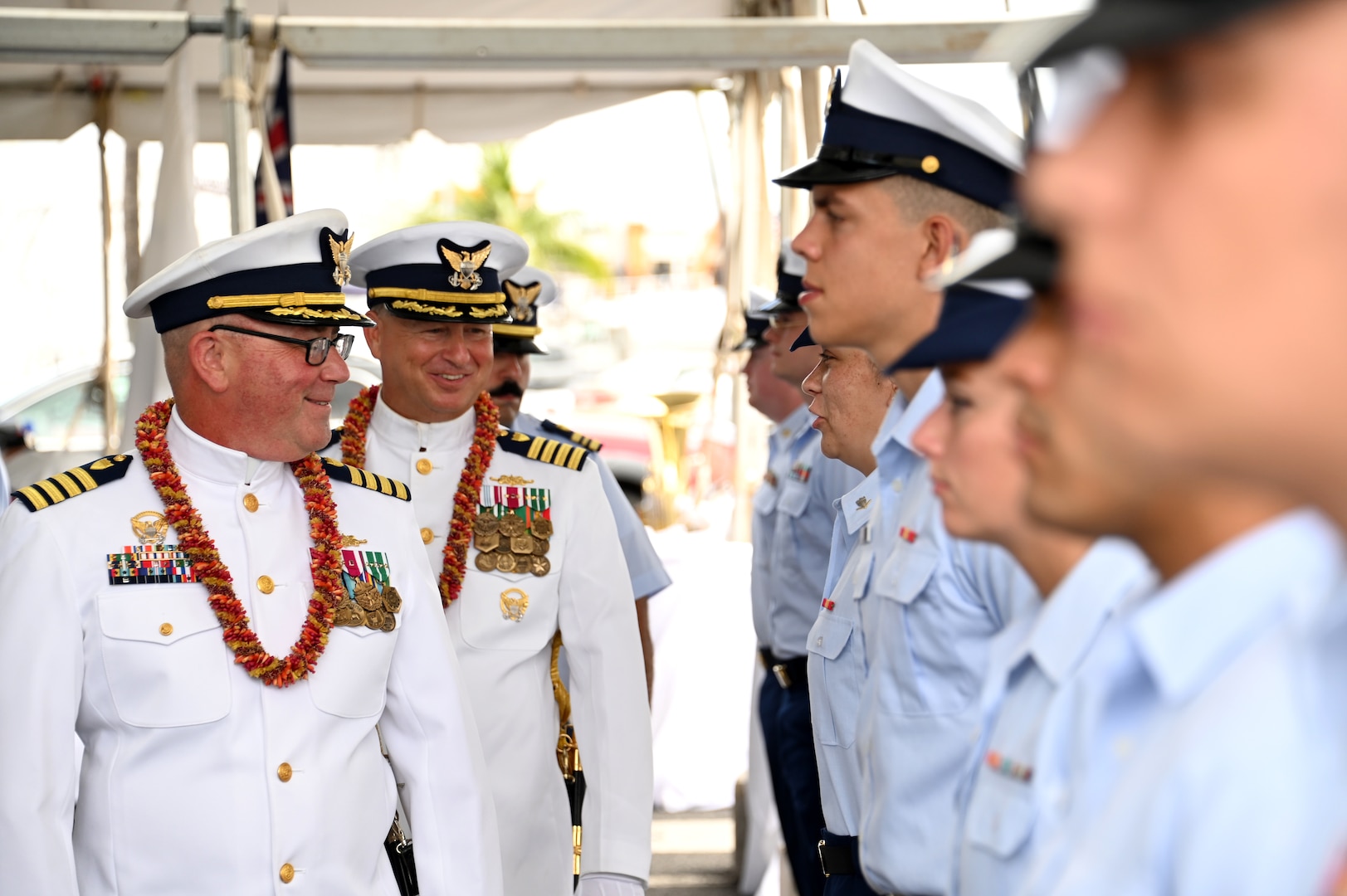 Capt. Tom D’Arcy (left) and Capt. Bob Kinsey (right) conduct a personnel inspection during the U.S. Coast Guard Cutter Kimball’s (WMSL 756) change of command ceremony on Base Honolulu, July 21, 2023. Rear Adm. Brendan C. McPherson, deputy commander of U.S. Coast Guard Pacific Area, presided over the ceremony in which Kinsey relieved D’Arcy as Kimball’s commanding officer. U.S. Coast Guard photo by Chief Petty Officer Matthew Masaschi.
