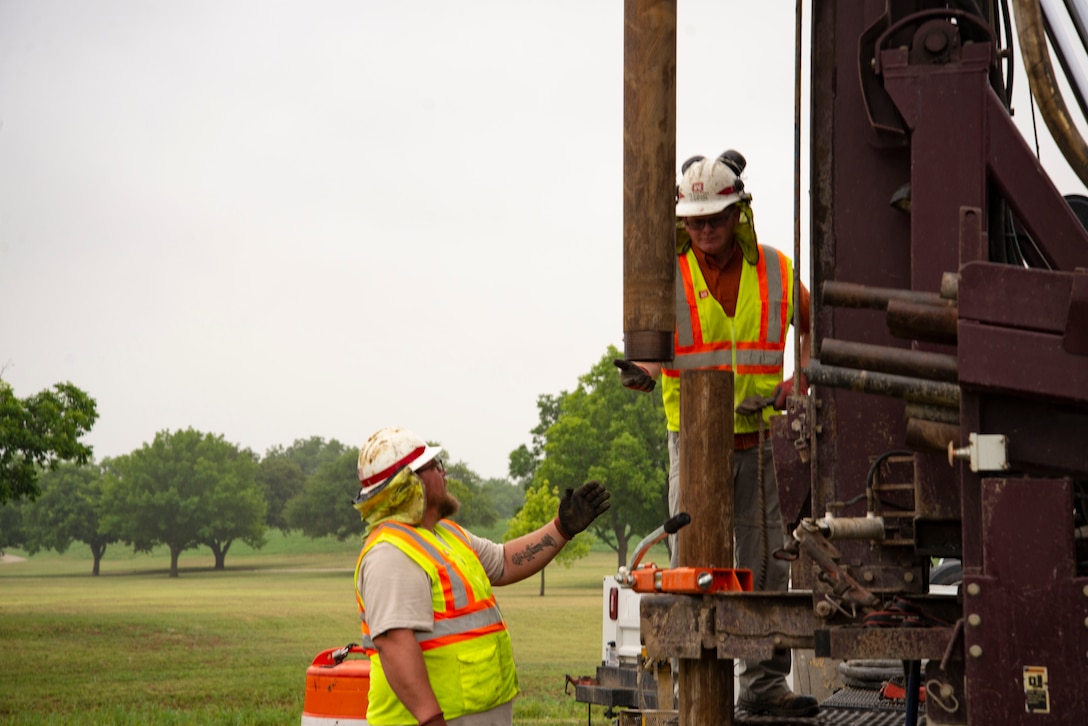 Drillers operate equipment along the Trinity River in Fort Worth, Texas.