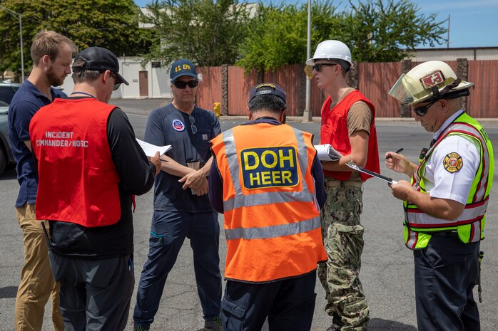 Joint Task Force-Red Hill (JTF-RH) personnel and stakeholder representatives discuss the exercise start situation before beginning a spill response exercise on Joint Base Pearl Harbor-Hickam, Hawaii, June 8, 2023. This exercise is mandated by the DOH emergency state order and the EPA 2023 Consent Order. JTF-RH Response Directorate’s sole purpose is to protect the aquifer and environment by analyzing every possible spill scenario and developing appropriate mitigation measures. JTF-RH is committed to working with all local, state, and government agencies to ensure Red Hill is defueled safely, expeditiously, and in compliance with all federal, state and local laws, policies and regulations. (DoD photo by U.S. Army Spc. Matthew Mackintosh)