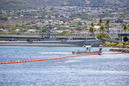 Joint Task Force-Red Hill (JTF-RH) and spill response personnel perform and observe a spill response exercise on Joint Base Pearl Harbor-Hickam, Hawaii, June 8, 2023. JTF-RH and spill response personnel use utility boats to create a barrier with a boom to provide containment in the case of a spill. A rapid response skimmer boat and a vacuum truck with an attached portable skimmer is used to vacuum any contaminants present in the contained area. This exercise is mandated by the DOH emergency state order and the EPA 2023 Consent Order. JTF-RH Response Directorate’s sole purpose is to protect the aquifer and environment by analyzing every possible spill scenario and developing appropriate mitigation measures. JTF-RH is committed to working with all local, state, and government agencies to ensure Red Hill is defueled safely, expeditiously, and in compliance with all federal, state and local laws, policies and regulations. (DoD photo by U.S. Army Spc. Matthew Mackintosh)