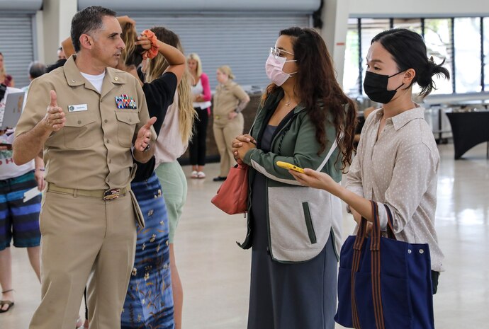 Joint Task Force-Red Hill (JTF-RH) Deputy Staff Judge Advocate, U.S. Navy Cmdr. Gilbert Serrano, speaks with local residents at JTF-RH’s National Environmental Policy Act (NEPA) Draft Environmental Assessment/Overseas Environmental Assessment (EA/OEA) Public Meeting at Ke’ehi Lagoon Memorial, Honolulu, Hawaii, June 15, 2023. JTF-RH hosted the public meeting to provide the public with information regarding the NEPA Draft EA/OEA, accept comments, and an opportunity to engage directly with subject matter experts. JTF-RH is in phase three of its five-phase defueling plan. Personnel are focused on completing repairs, quality control tasks, training, response preparation, the NEPA Environmental Assessment, regulatory approvals and operational planning for all major milestones. This extensive preparatory work will help ensure the safe and expeditious defueling of the Red Hill Bulk Fuel Storage Facility. (DoD photo by U.S. Army Sgt. Kyler Chatman)