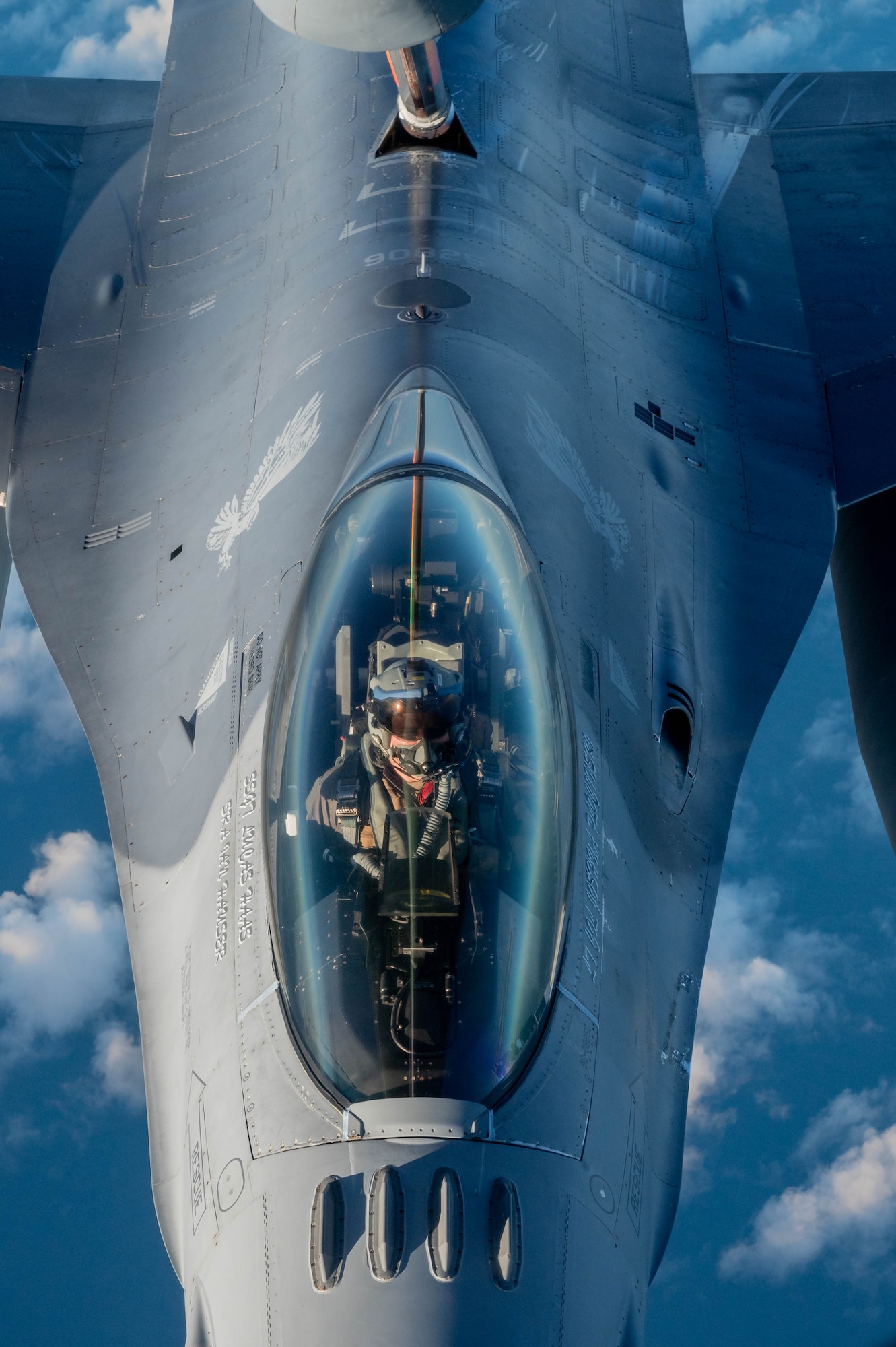 Airmen From Macdill Air Force Base, Florida refuel F-16 Fighting Falcons from Kadena Air Base, Japan in support of Mobility Guardian 2023 July 9th, 2023, over the Indo Pacific region. A multilateral endeavor, MG23 features seven participating countries - Australia, Canada, France, Japan, New Zealand, United Kingdom, and the United States - operating approximately 70 mobility aircraft across multiple locations spanning a 3,000 mile exercise area from July 5th through July 21. Our Allies and partners are one of our greatest strengths and a key strategic advantage. (U.S. Air Force photo by Shelby Rapert)