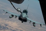 A Royal Air Force Eurofighter Typhoon FGR4 refuels from a KC-10 Extender assigned to the 908th Expeditionary Air Refueling Squadron during Yellow Sands, the Counter-Unmanned Aircraft Systems (C-UAS) exercise in Southwest Asia, July 20, 2023. The exercise aimed to ensure the safety of forces and the success of ongoing missions by enhancing the collective capacity to detect, track and neutralize UAS threats. (U.S. Air Force photo by Staff Sgt. Emily Farnsworth)