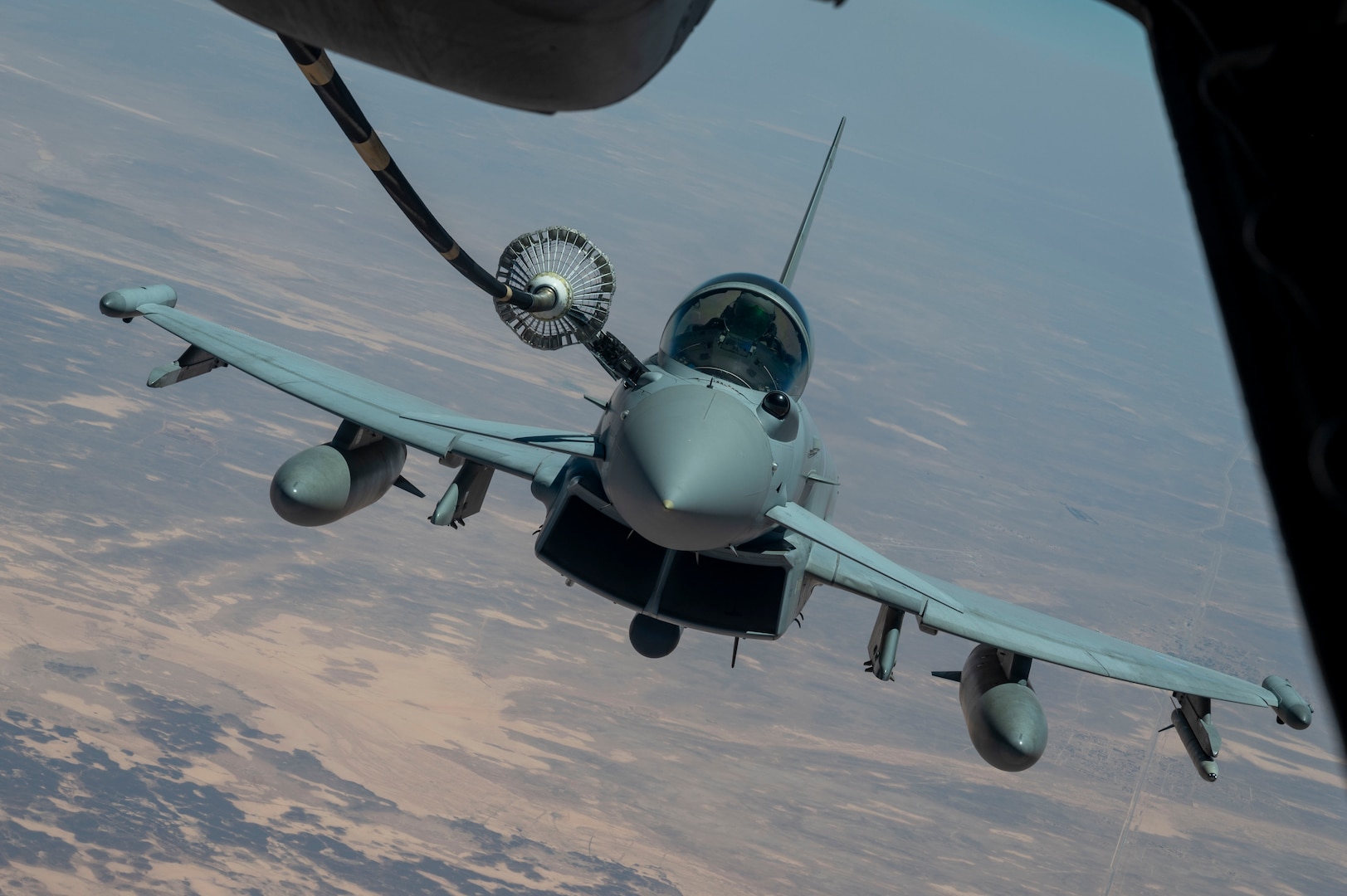 A Royal Air Force Eurofighter Typhoon FGR4 refuels from a KC-10 Extender assigned to the 908th Expeditionary Air Refueling Squadron during Yellow Sands, the Counter-Unmanned Aircraft Systems (C-UAS) exercise in Southwest Asia, July 20, 2023. The exercise aimed to ensure the safety of forces and the success of ongoing missions by enhancing the collective capacity to detect, track and neutralize UAS threats. (U.S. Air Force photo by Staff Sgt. Emily Farnsworth)