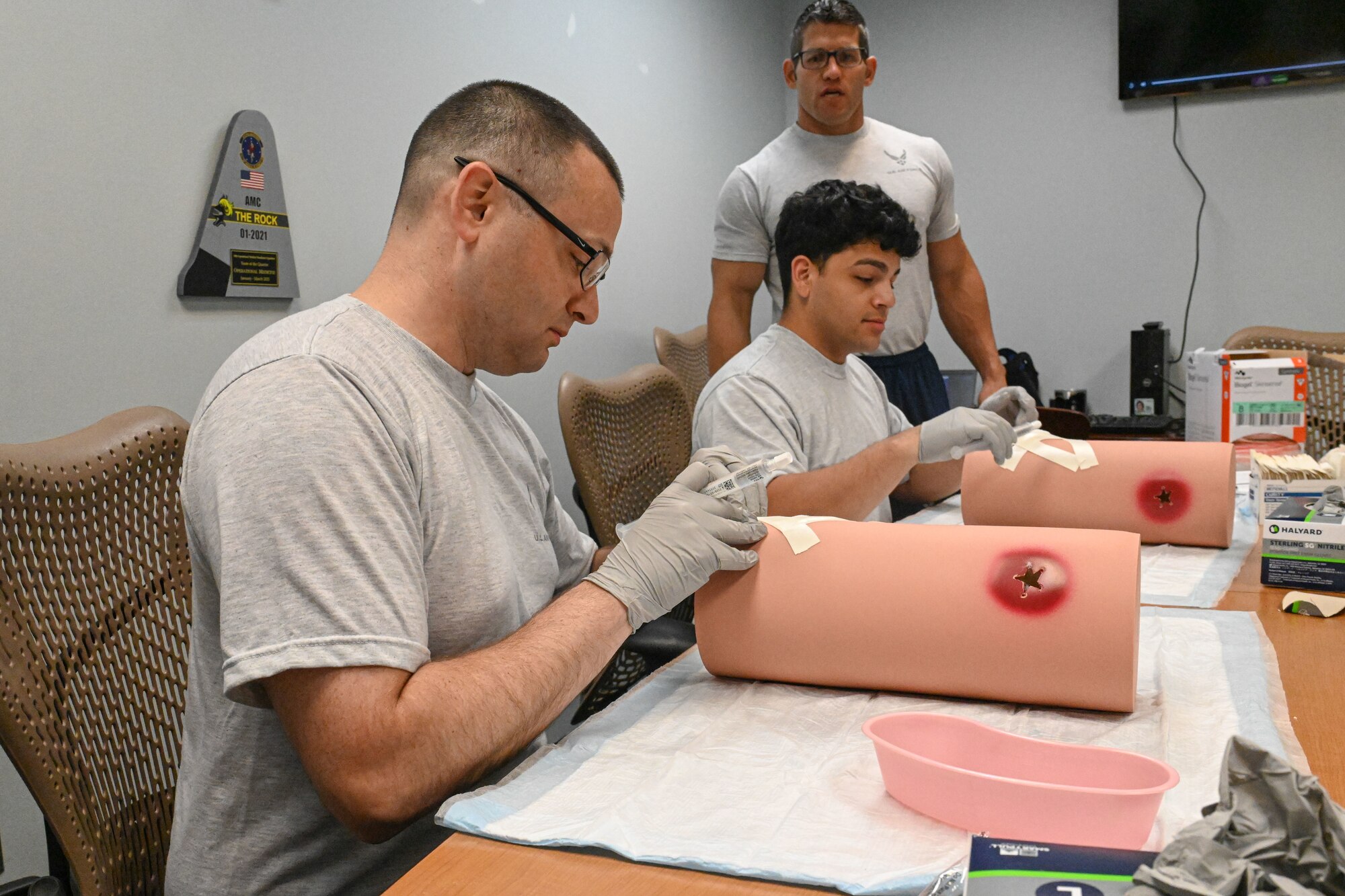 Airmen perform Tactical Combat Casualty Care skills.