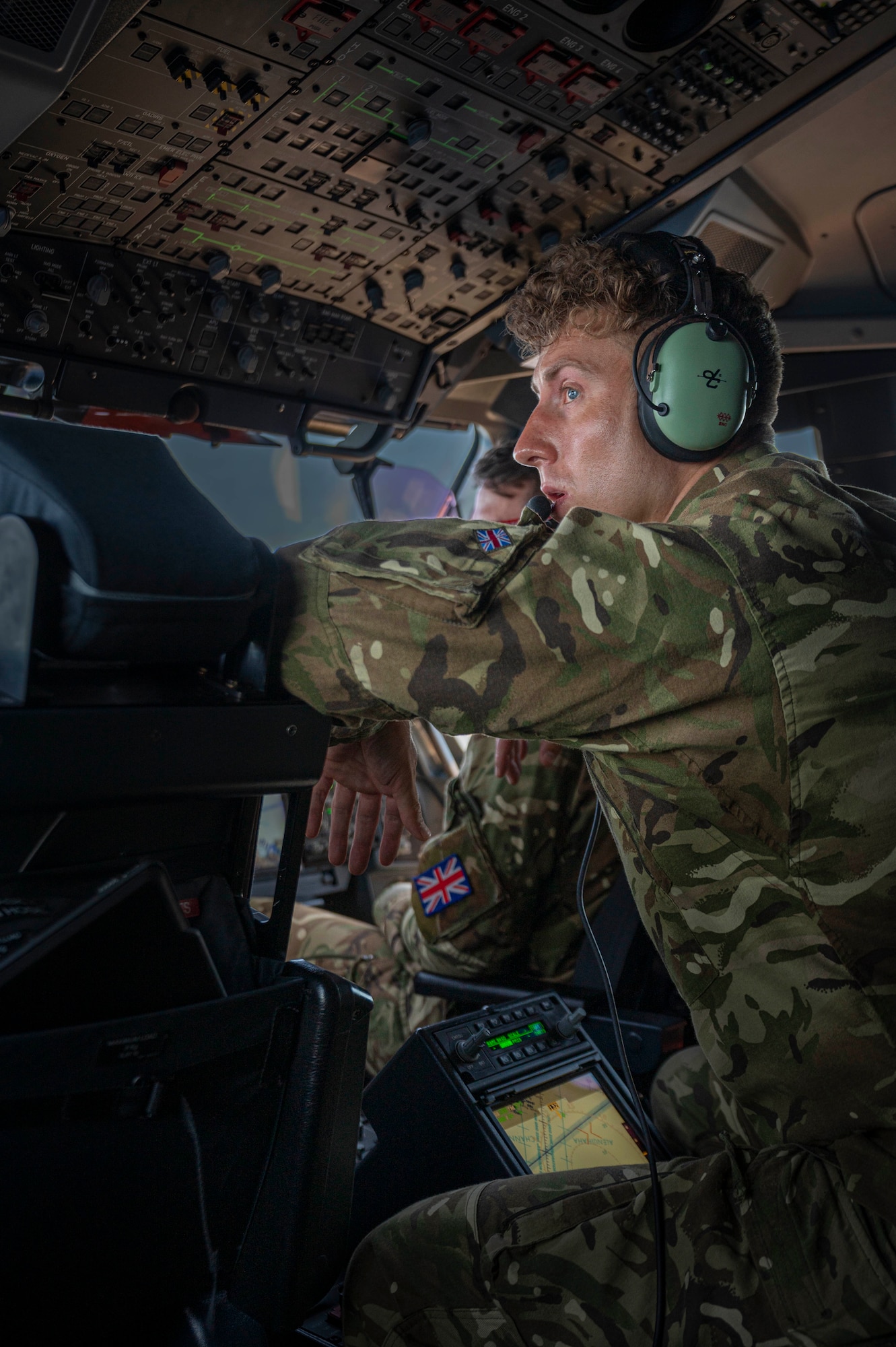 Royal Air Force Flight Lt. Rob Hughes looks out the window of a Royal Air Force A400M Atlas during a familiarization flight over Hawaii during Mobility Guardian 23, July 10, 2023. MG23 features seven participating countries - Australia, Canada, France, Japan, New Zealand, United Kingdom, and the United States - operating approximately 70 mobility aircraft across multiple locations spanning a 3,000 mile exercise area. Our Allies and partners are one of our greatest strengths and a key strategic advantage. MG23 is an opportunity to deepen our connections with regional Allies and partners using bold initiatives. (U.S. Air Force photo by Senior Airman Tiffany Del Oso)