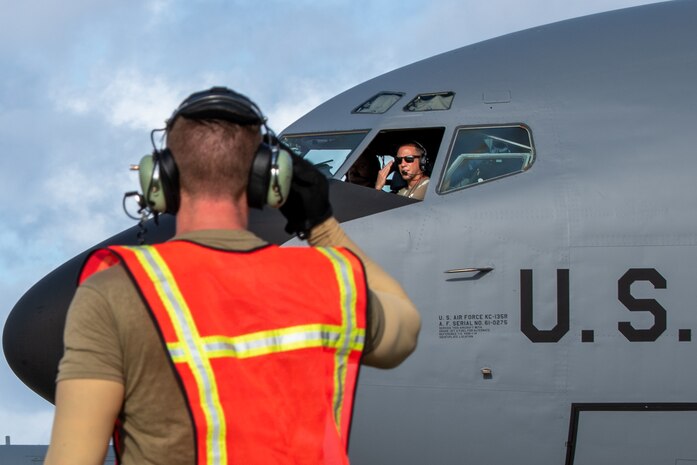 Airmen salute each other.