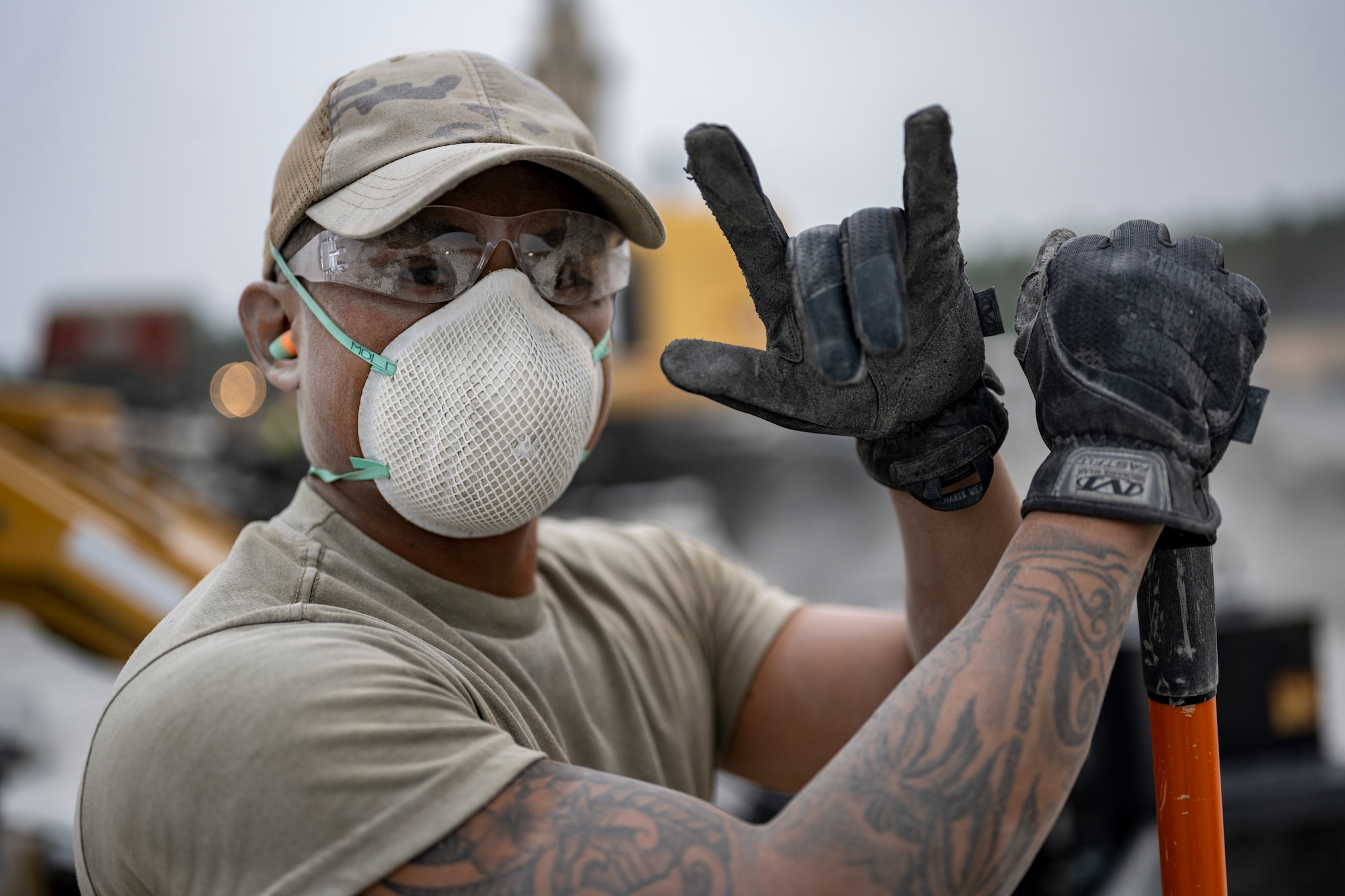 A U.S. Air Force Airman assigned to the 18th Civil Engineer Group poses for a photo during a bilateral live fire exercise.