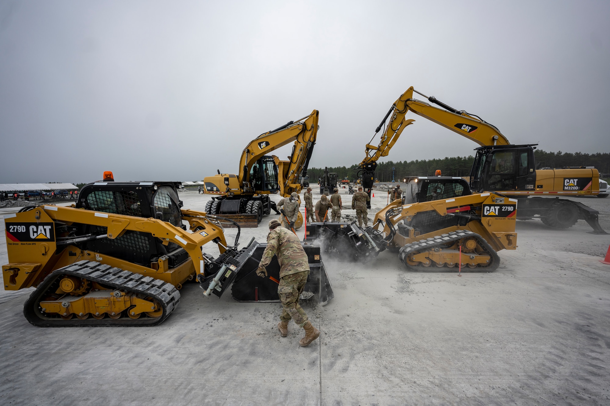 U.S. Air Force Airmen assigned to the 18th Civil Engineer Group from Kadena Air Base conduct rapid airfield damage recovery training during a bilateral live fire exercise.