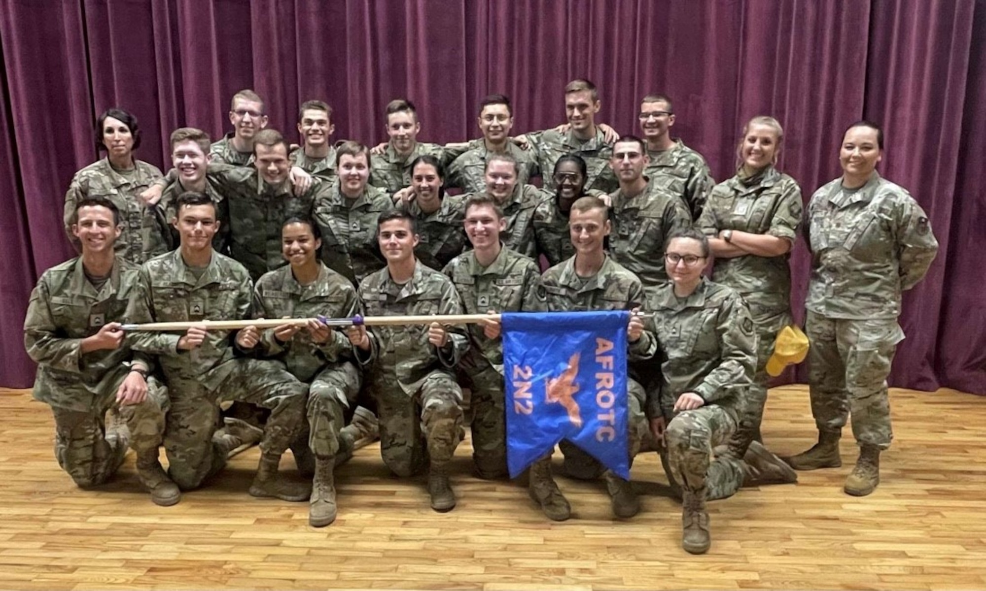 U.S. Air Force 1st Lt. Catherine J. Grimm, 97th Air Mobility Wing judge advocate chief of adverse actions, poses for a group photo with Reserve Officers' Training Corps at Hattiesburg, Minnesota, July 10, 2021. Grimm recently transitioned into active duty after joining the Reserve Officers' Training Corps and has a goal of becoming a colonel. (Courtesy photo)