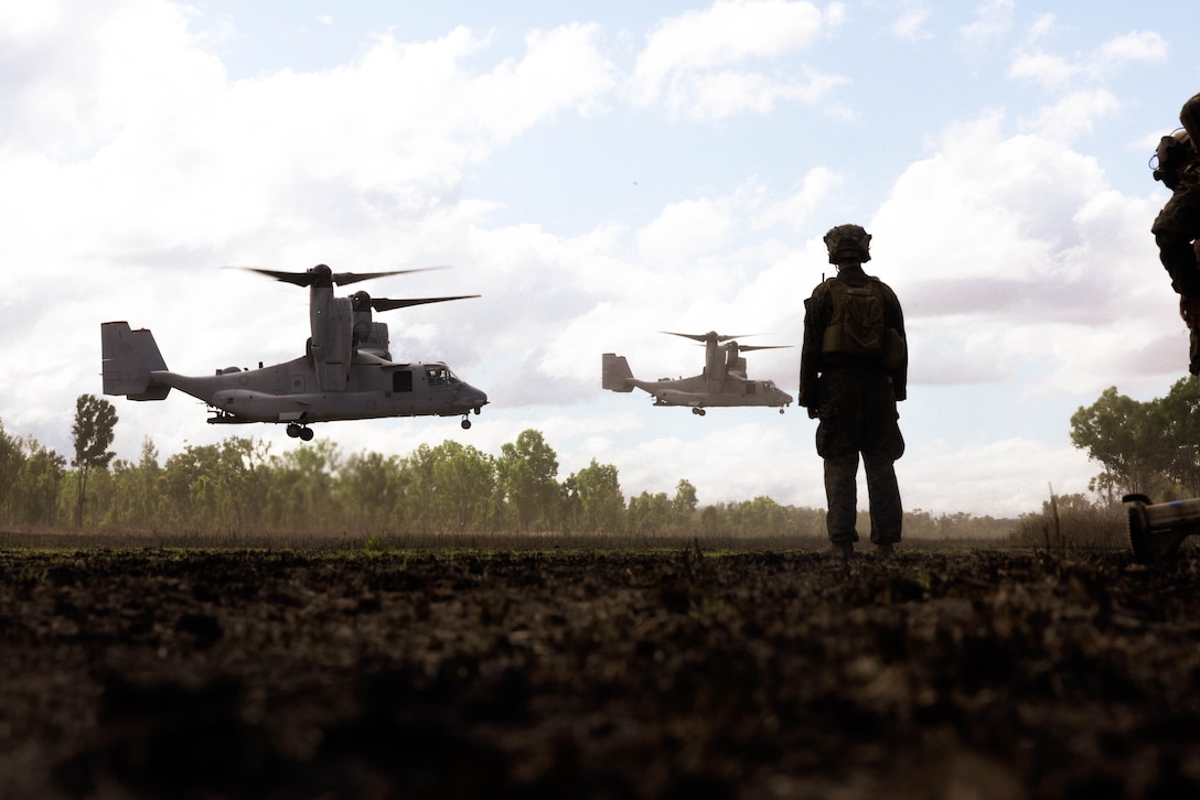 U.S. Marine Corps 1st Lt. Joshua Watson, the executive officer of Lima Co., 3rd Battalion, 1st Marine Regiment, Marine Rotational Force – Darwin 23, watches MV-22B Osprey tiltrotor aircraft land during Exercise Southern Jackaroo 23 in Townsville Field Training Area, Queensland, Australia, July 6, 2023. Southern Jackaroo is a trilateral exercise with MRF-D, Japanese Ground Self-Defense Force, and Australian Defense Force, with Republic of Korea observers, working together to achieve fire, maneuver, and communications interoperability objectives. Watson is a native of Woodbridge, Virginia.
