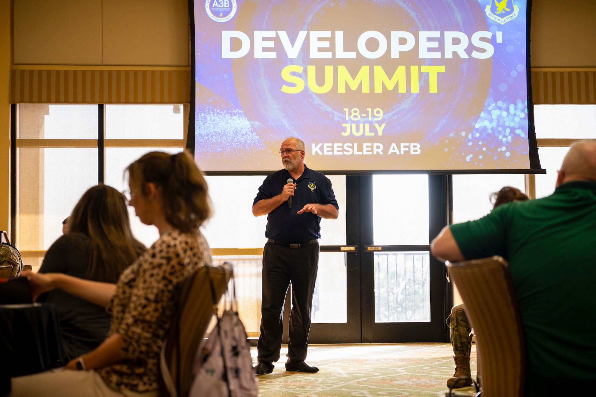 Dr. Brian Davis speaks to crowd during his speech at the Developers' Summit.
