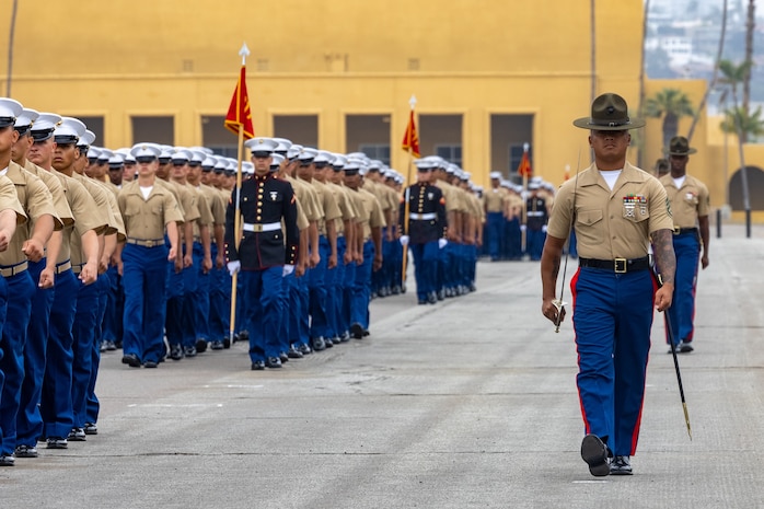 A U.S. Marine Corps drill instructor with Hotel Company, 2nd Recruit Training Battalion, marches in formation with his platoon at a graduation ceremony for Hotel Company, 2nd Recruit Training Battalion, at Marine Corps Recruit Depot (MCRD) San Diego, July 21, 2023.
