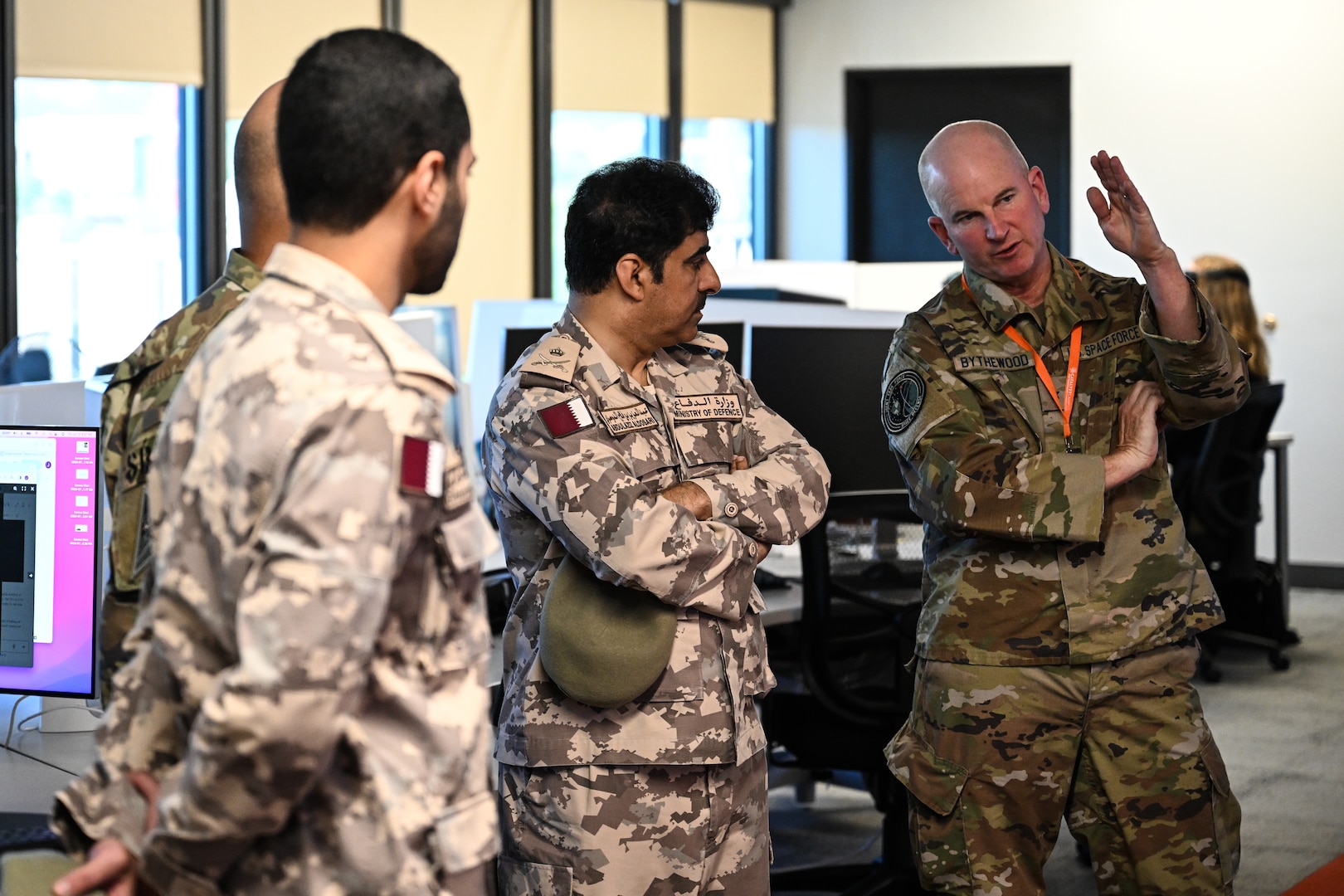 Group photo of men in US and Qatari military uniforms