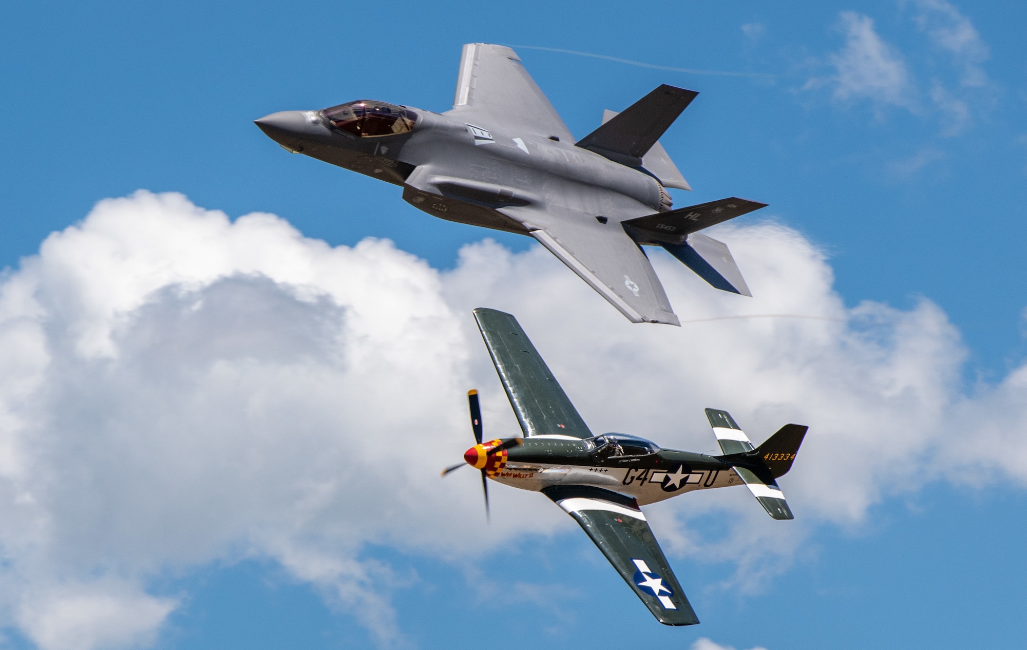 AN F-35 and an Older P-51 mustang flying in tandum