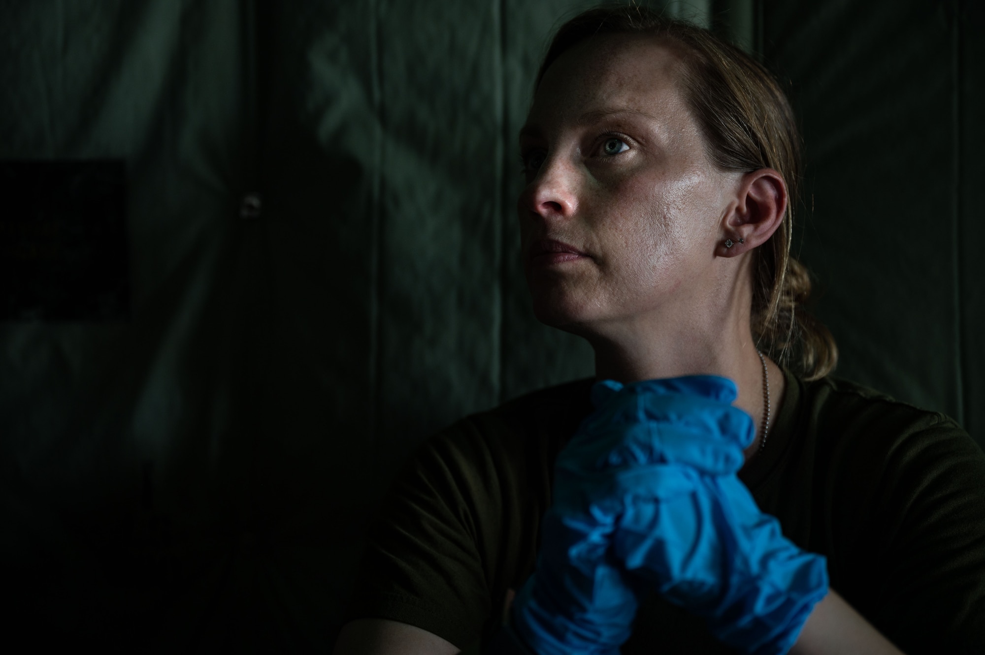 Royal Canadian Air Force Major Melissa Gear, a flight surgeon assigned to the Canadian Air Division Headquarters, simulates giving care to a patient in a static RCAF CC130J Super Hercules aircraft during Mobility Guardian 23 at Andersen Air Force Base, Guam, July 10, 2023. MG23 is an opportunity to train alongside our Allies and partners to demonstrate interoperability and bolster our collective ability to support a free and open Indo-Pacific. (U.S. Air Force photo by Staff Sgt. Taylor Crul)