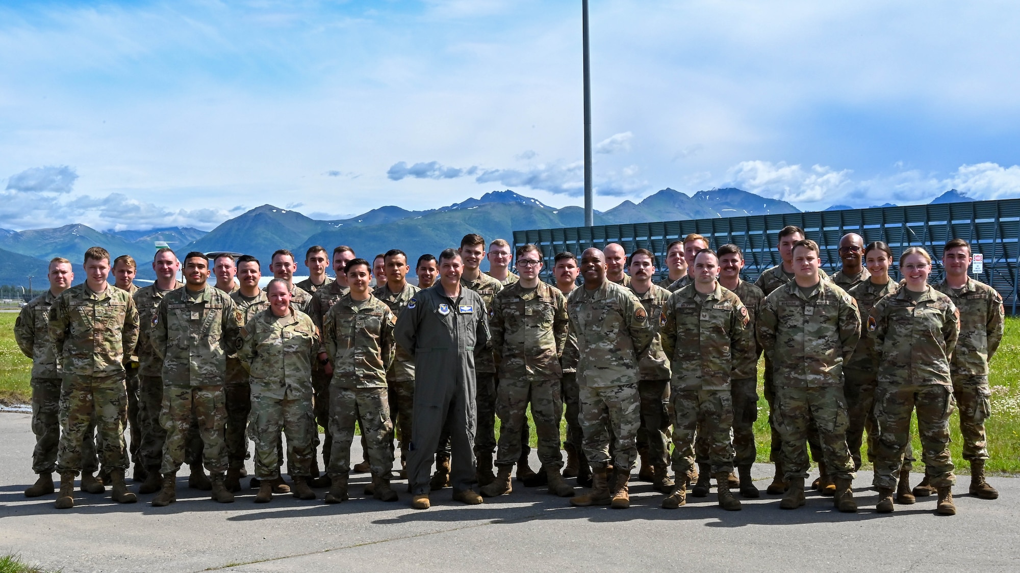 Bomber Airmen from Dyess AFB, Texas and Minot AFB, N.D., stand with 8th Air Force leadership on the flightline at JBER, Alaska, during an all bomber Agile Combat Employment exercise, July 18, 2023.