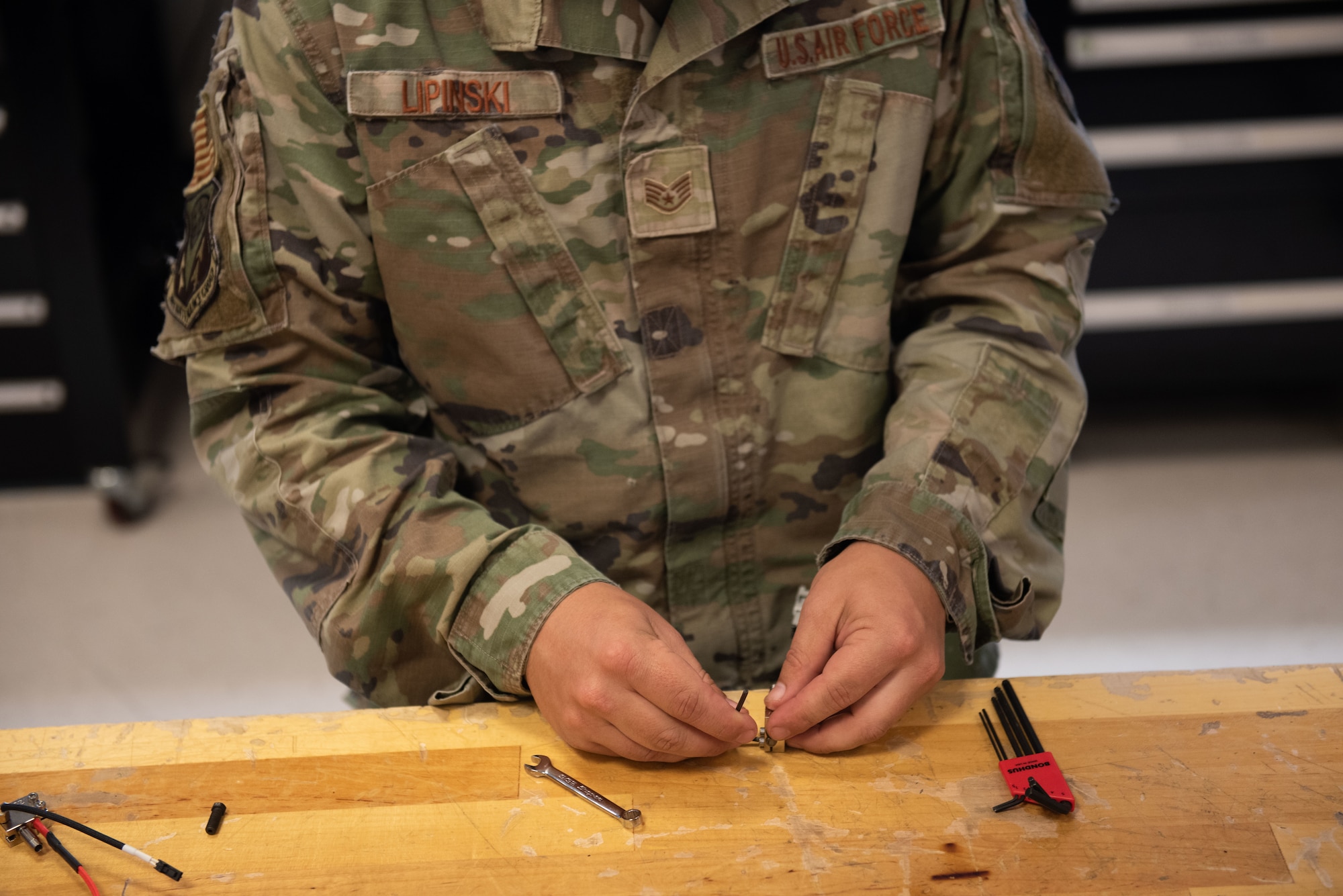 Technician assembles component.