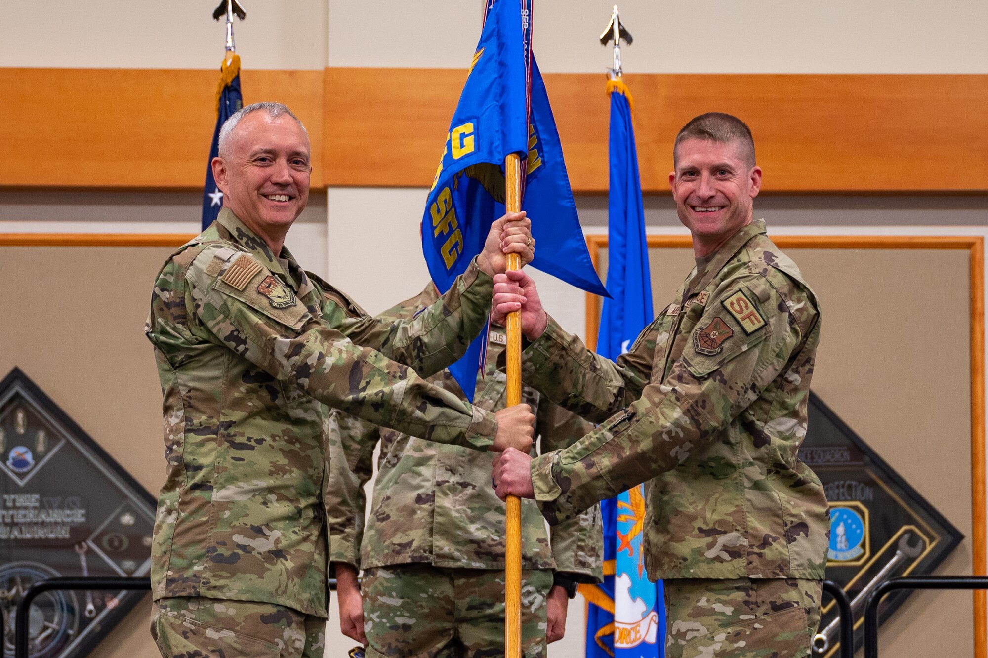 Men holding flag.