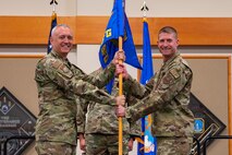 Men holding flag.