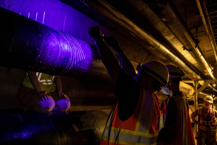 Contracted mechanical and integrity engineers working for Naval Facilities Engineering Systems Command Fleet Logistics Center Pearl Harbor, conducts a three-dimensional scan on to confirm structural integrity of fuel pipes at the Red Hill Bulk Fuel Storage Facility (RHBFSF) in Halawa, Hawaii, Dec. 20, 2022. Joint Task Force-Red Hill was established by the Department of Defense to ensure the safe and expeditious defueling of the RHBFSF. (U.S. Army photo by Spc. Matthew Mackintosh)