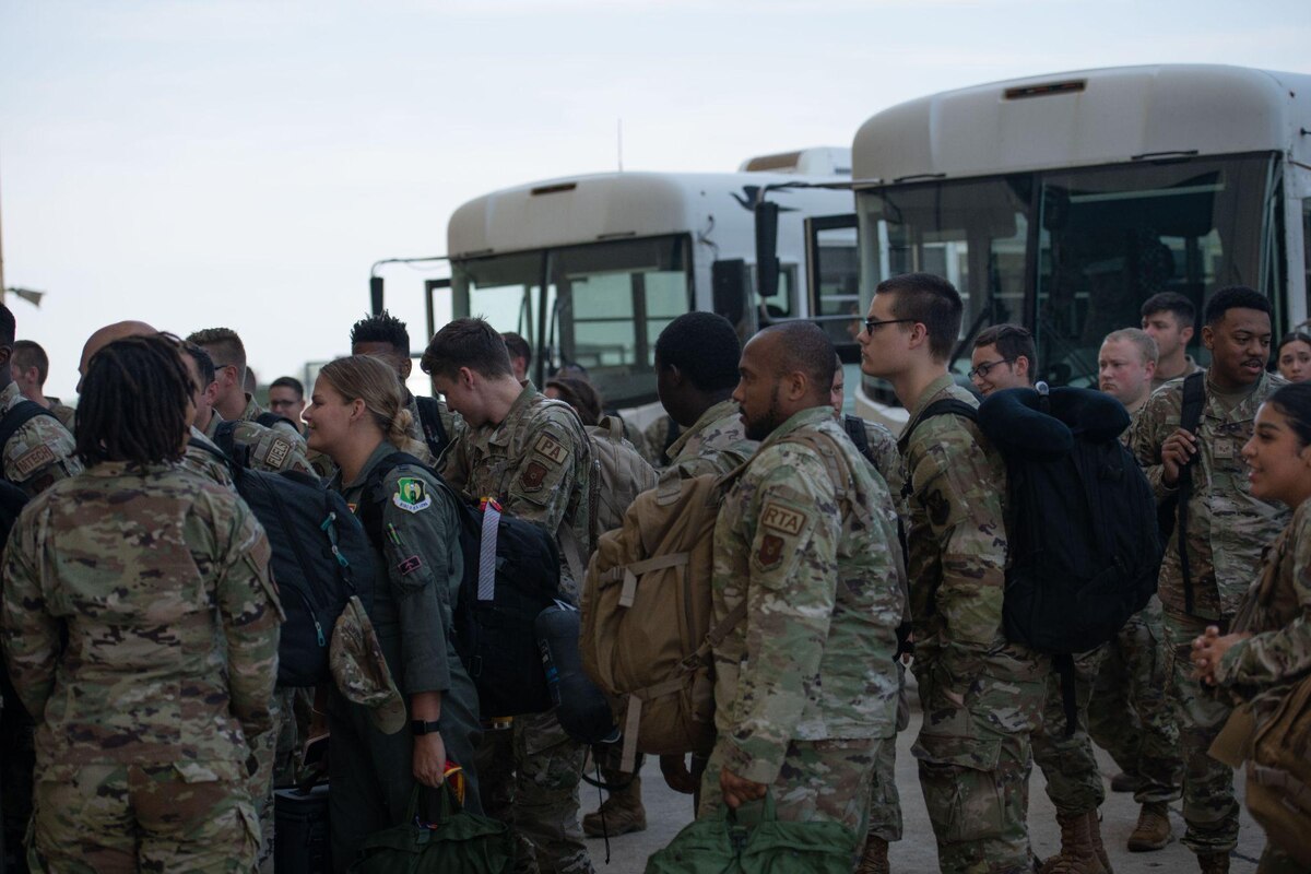 Airmen from the 5th Bomb Wing walk-offa bus after returning from a Bomber TaskForce mission at Minot Air Force Base,North Dakota, July 24, 2023. The Airmenspent six weeks in Guam in support ofBomber Task Force missions. (U.S. AirForce photo by Airman 1st Class TrustTate)
