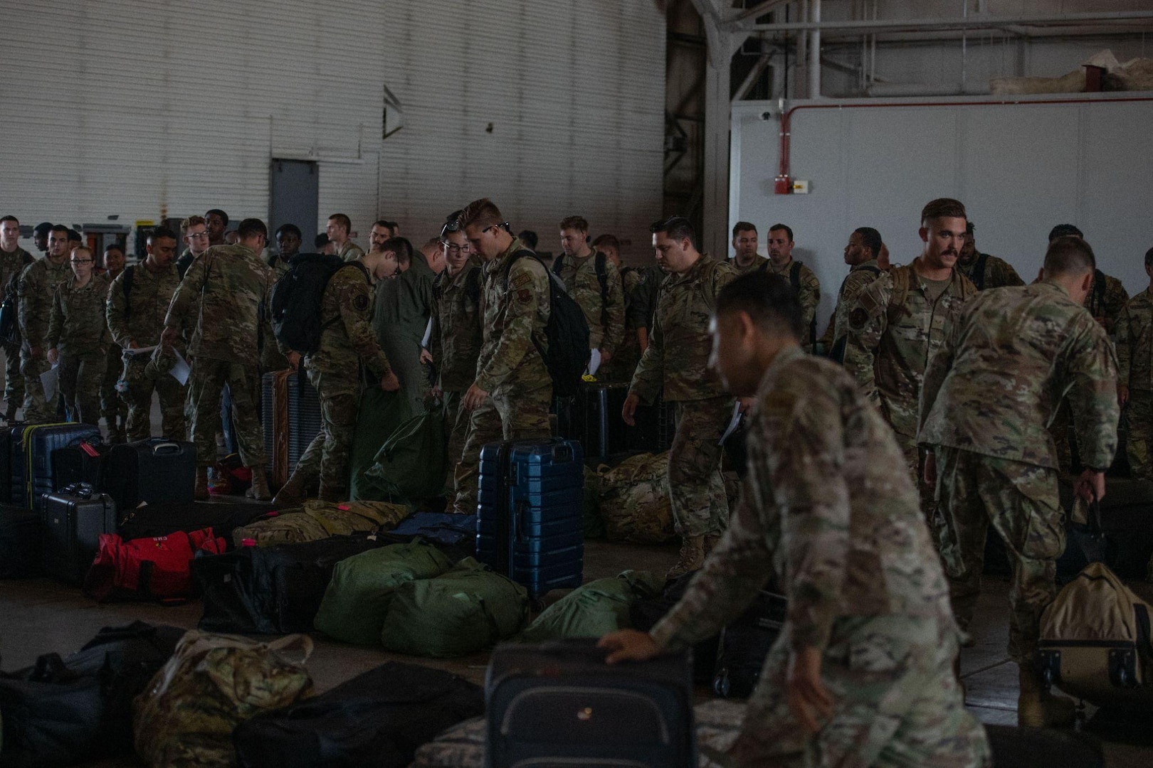 Airmen assigned to the 5th Bomb Wing
collect their luggage upon returning from
a Bomber Task Force mission at Minot Air
Force Base, North Dakota, July 24, 2023.
U.S. Strategic Command BTF missions
provide opportunities to train and work
with allies and partners in joint and
coalition operations and exercises. (U.S.
Air Force photo by Airman 1st Class Trust
Tate)