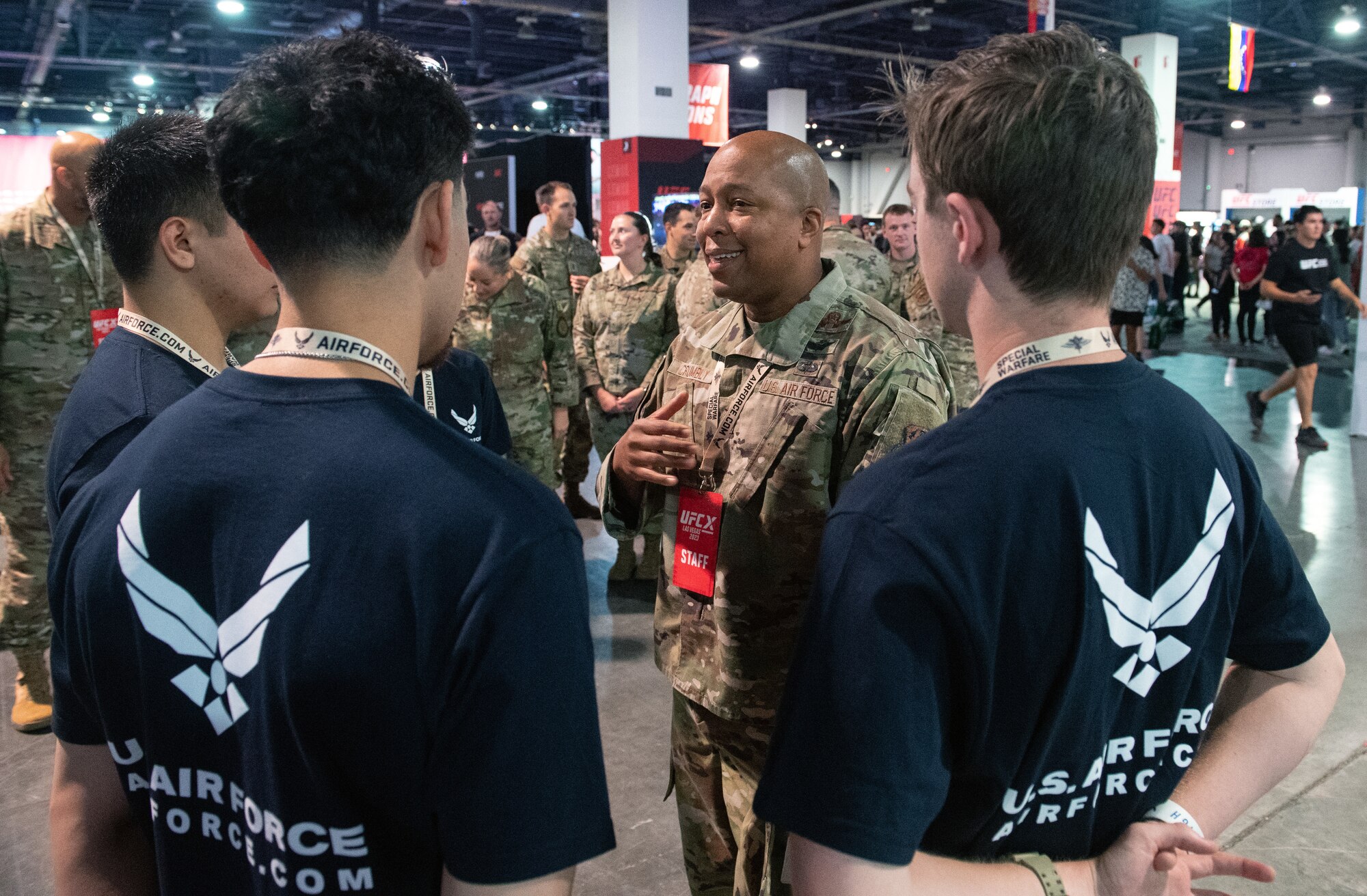 Maj. Gen. Konata Crumbly, Air National Guard advisor to the Air Force Recruiting Service commander, congratulates five members of the delayed enlistment program at the Ultimate Fighting Championship International Fight Week event in Las Vegas, July 3-July 9, 2023.