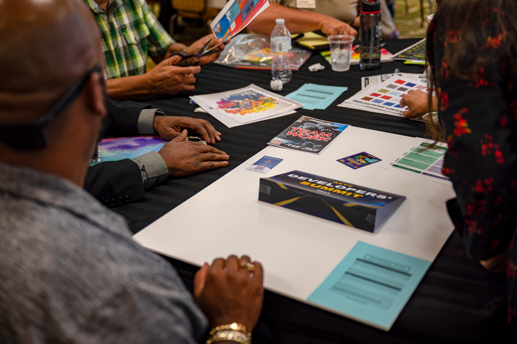Group works together to build an info graphic during the Developers' Summit.
