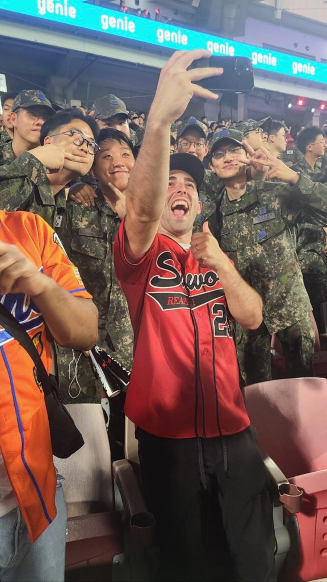 U.S. Air Force and Republic of Korea Air Force Airmen take a photo together during a baseball game at Suwon KT Wiz Park, Gyeonggi-do, ROK, June 30, 2023. The baseball game celebrated the 70th anniversary of the U.S.-ROK alliance. (U.S. Air Force courtesy photo by Maj. Joyce Lewis)