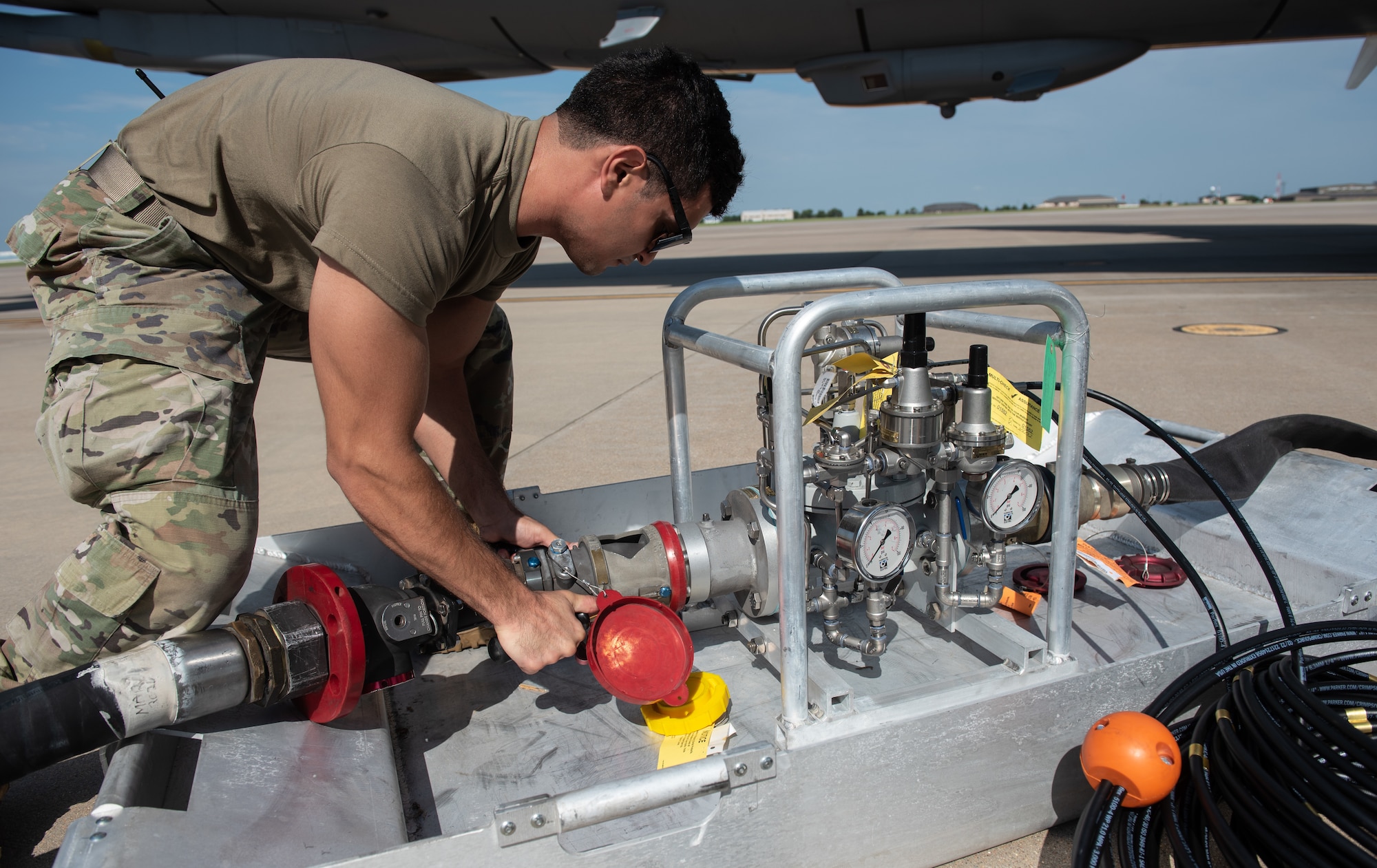 Airman 1st Class Alan Mitchell, 22nd Logistic Readiness Squadron fuels distribution operator, connects a hose from a fuel truck to a Versatile Integrating Partner Equipment Refueling (VIPER) kit July 13, 2023, at McConnell Air Force Base, Kansas. VIPER kits have the ability to conduct hot pit refueling of aircraft with any fuel infrastructure, making them a part of the Agile Combat Employment (ACE) construct. (U.S. Air Force photo by Staff Sgt. Tryphena Mayhugh)