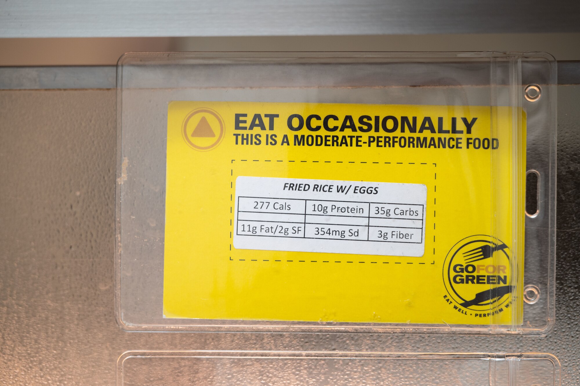 yellow "eat moderately" sign on the fried rice with eggs